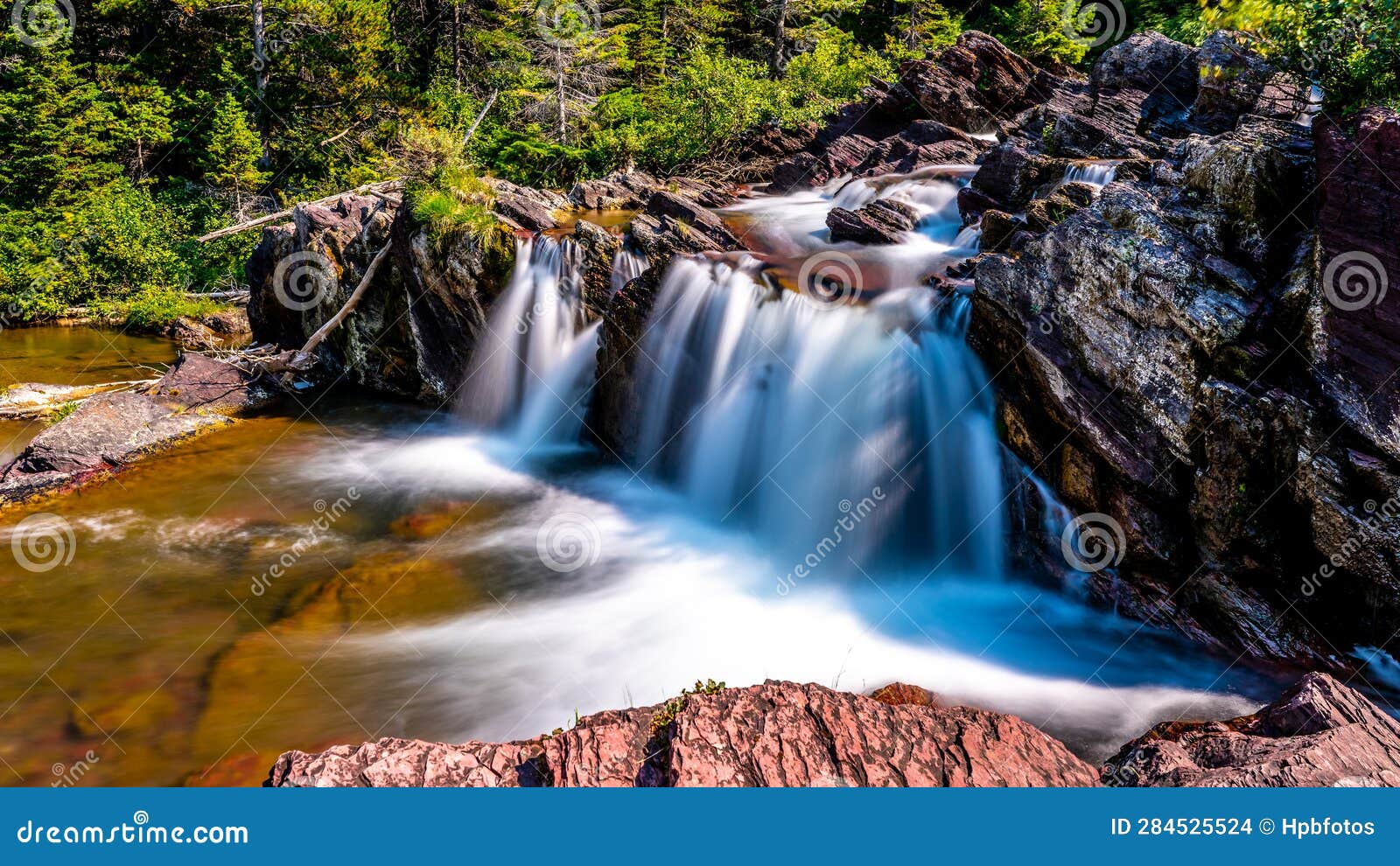 long exposure photo of the redrock falls in glacier national park
