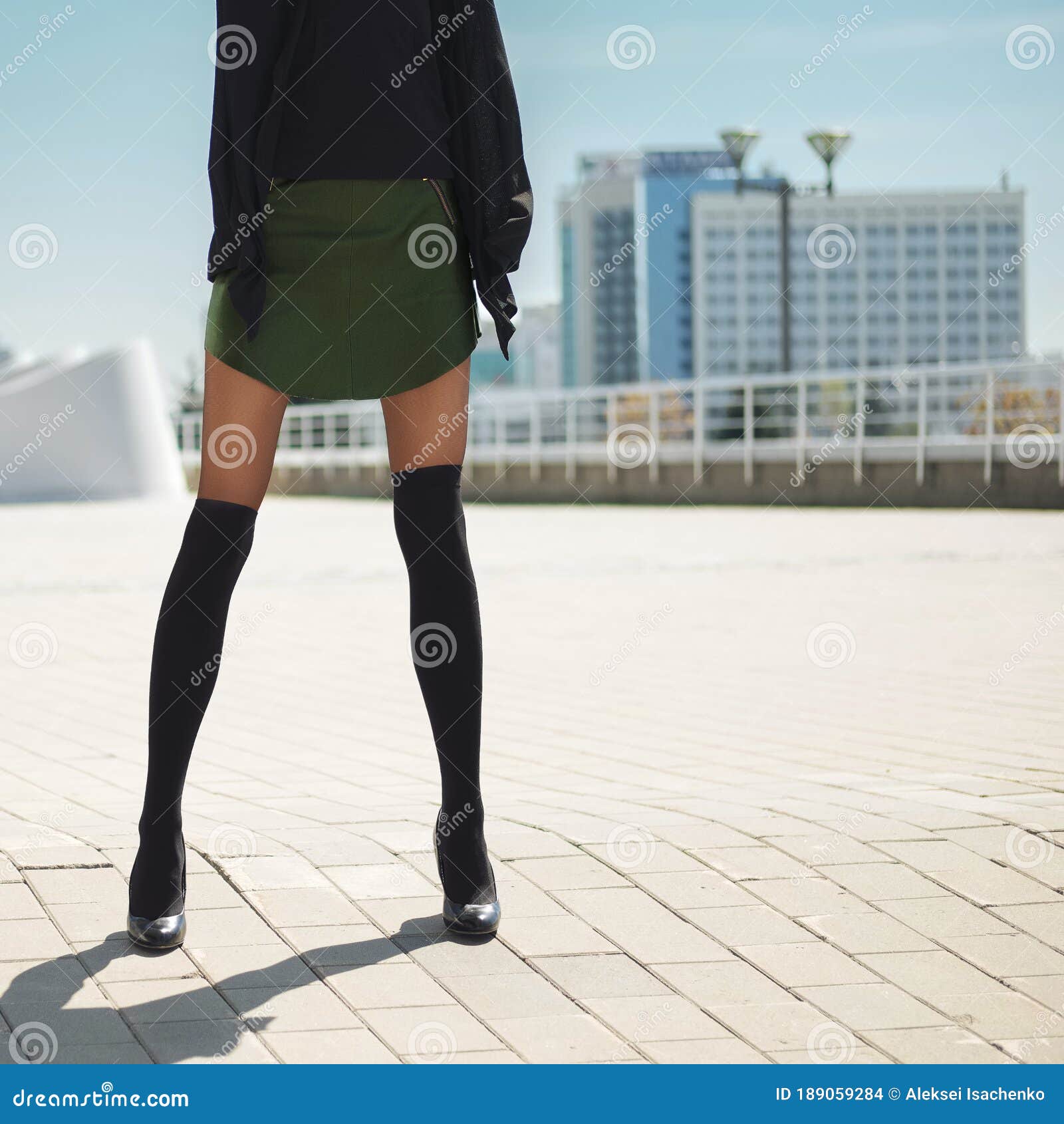 Long Female Legs in Knee Socks on Top of Tights and Short Leather Skirt ...