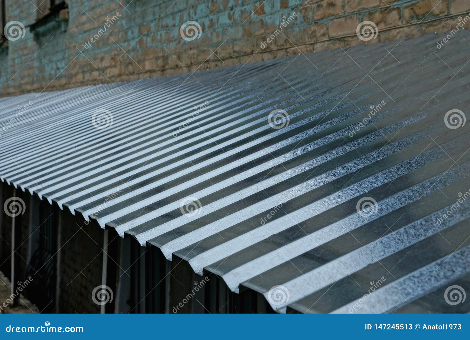 Long Gray Metal Roof Against the Wall Stock Image - Image of long ...