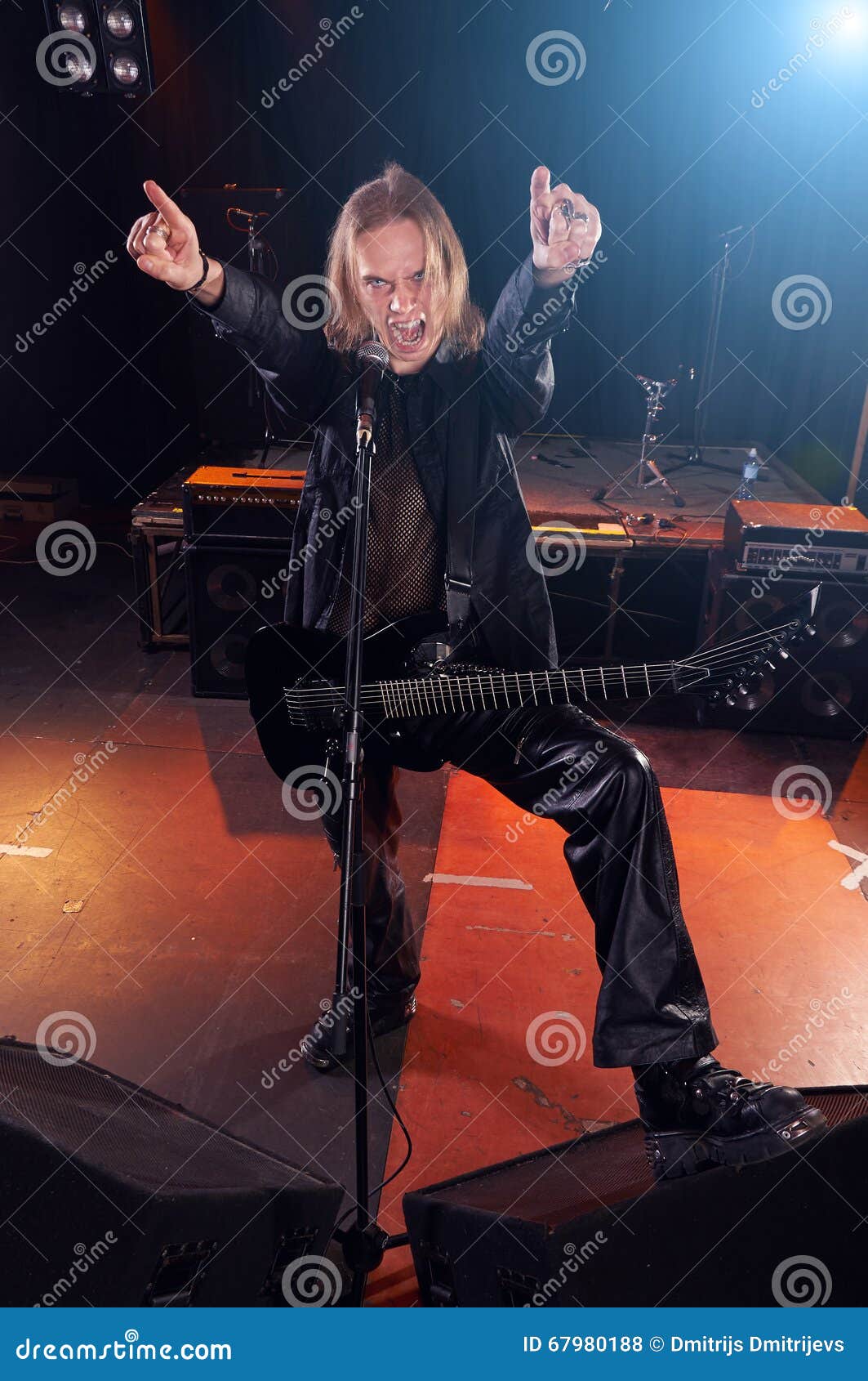 Long Haired Guitarist is Playing and Singing Stock Photo Image of