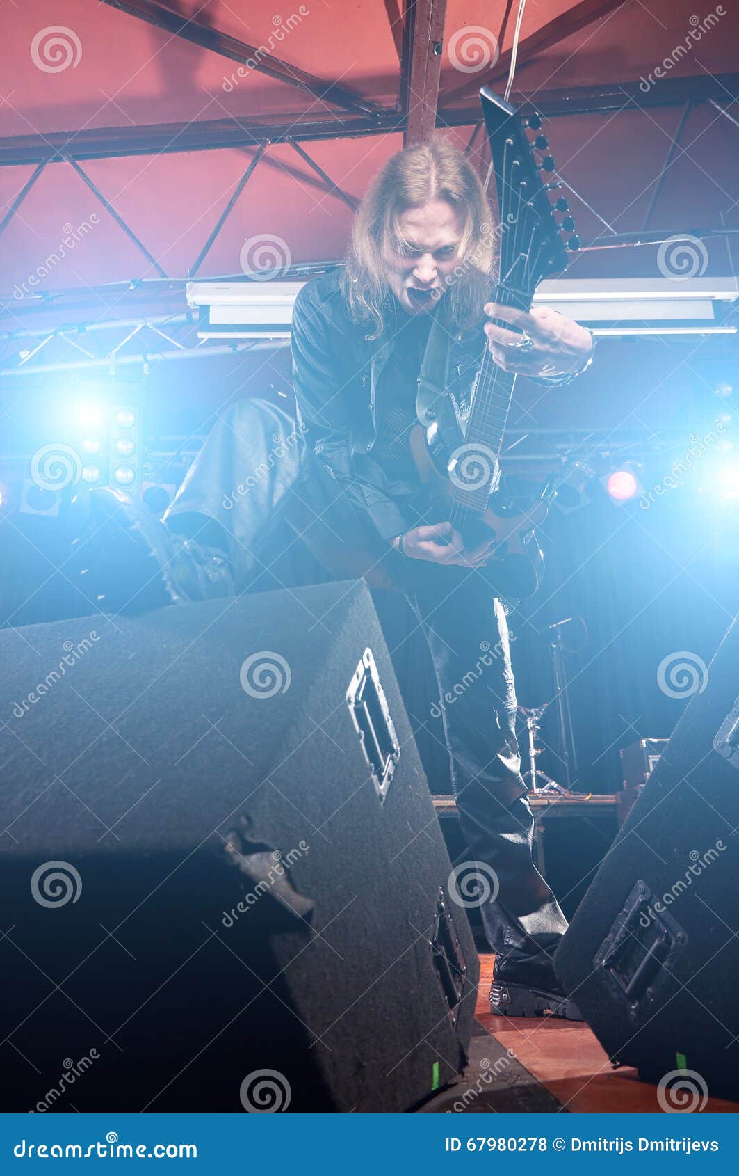 Long Haired Guitarist is Playing and Singing Stock Photo Image of