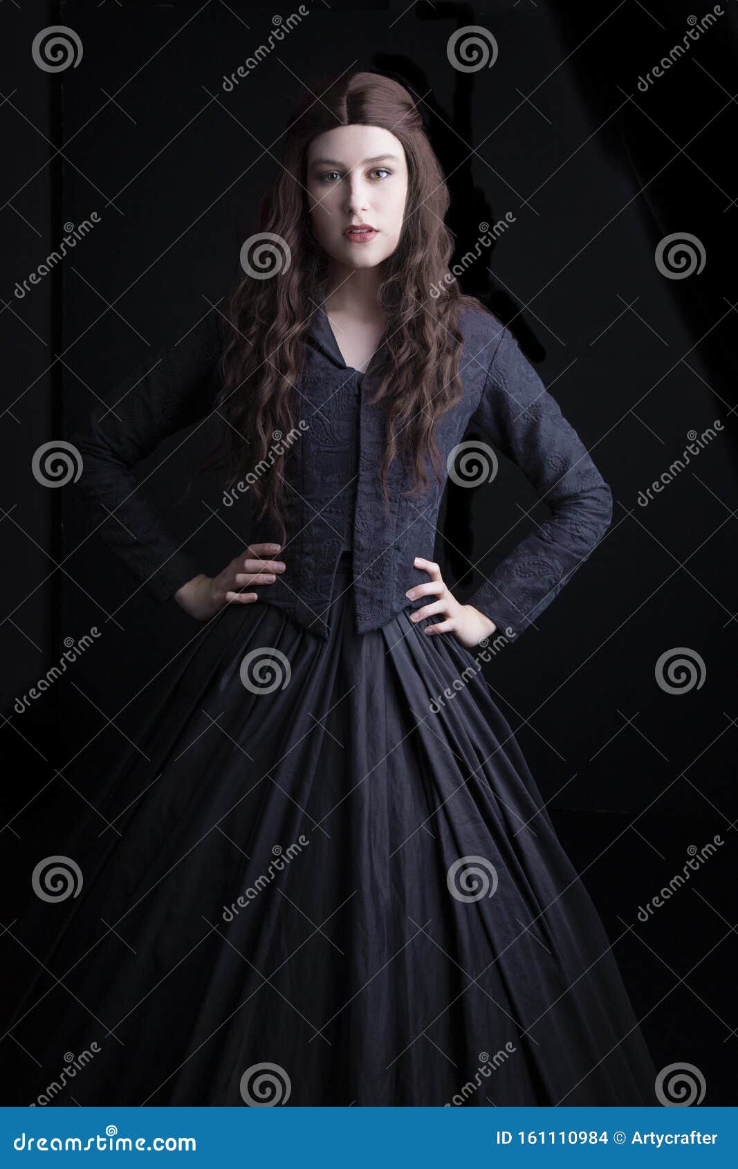 long-haired, brunette victorian woman in a black ensemble