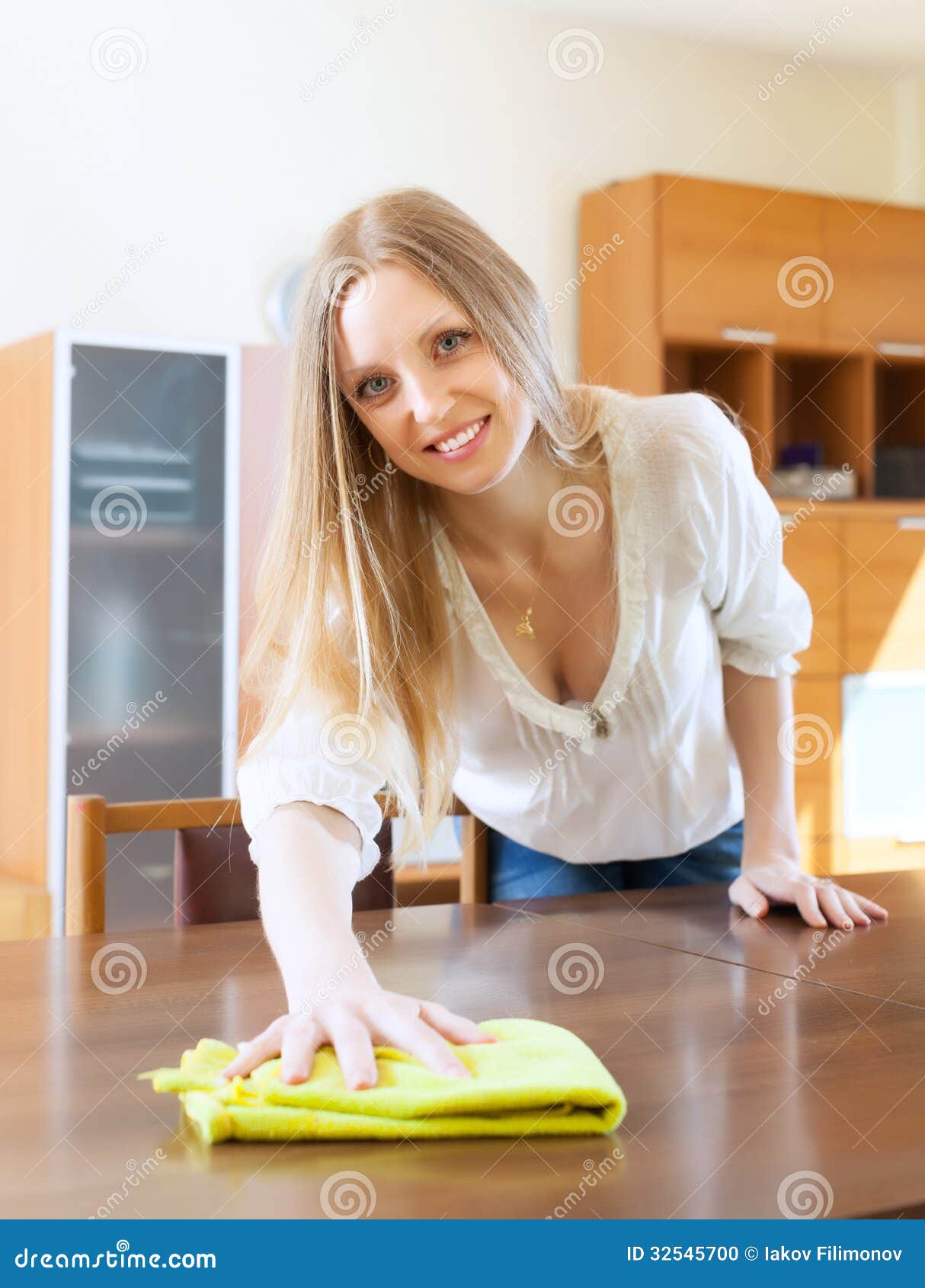 Long-haired Woman Cleaning Table Stock Photo - Image: 32545700