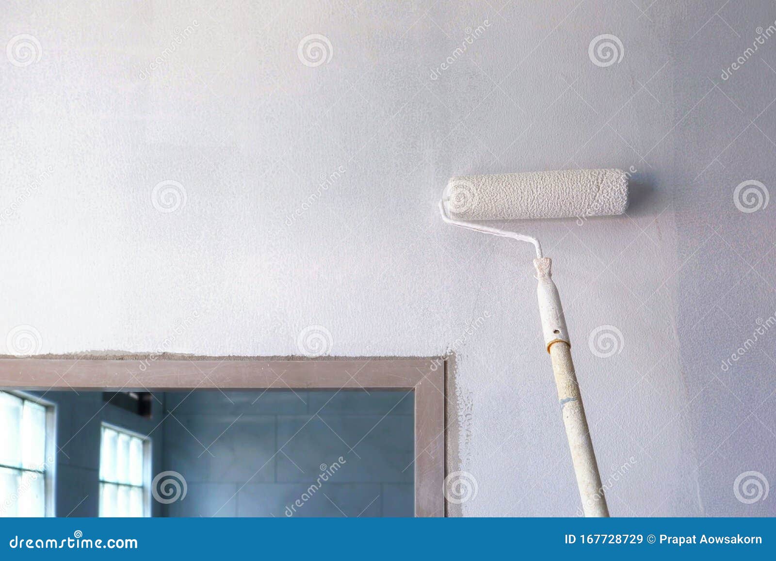 Long Handle Roller Brush Applying White Primer Paint on Concrete Wall Stock Image Image of