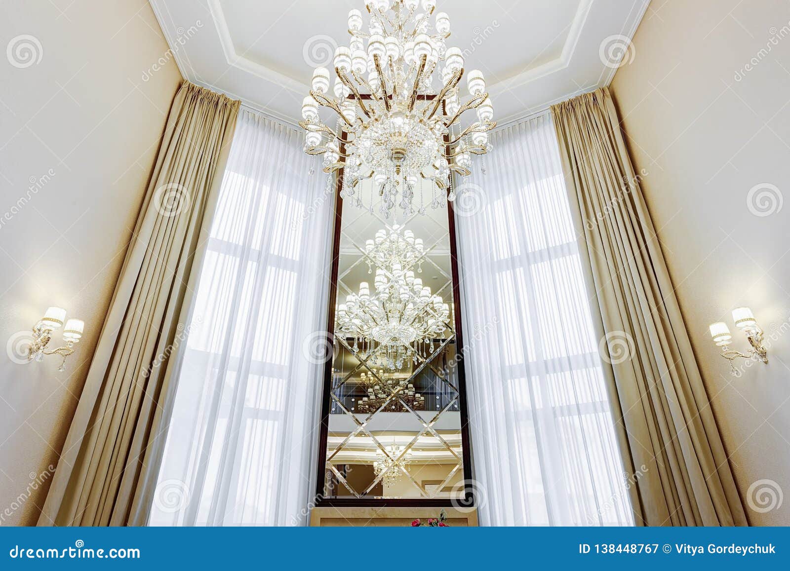 Long Mirror Between Windows In Luxury Interior Stock Image