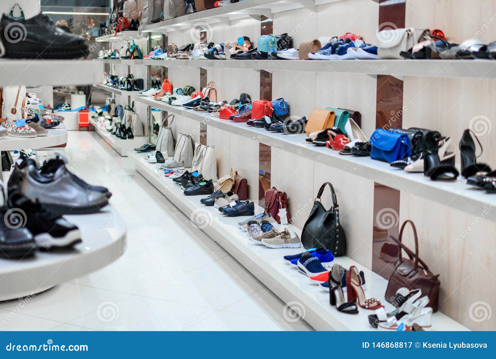 Long Rows Of Shelves With Shoes And Bags In The Store Stock Image