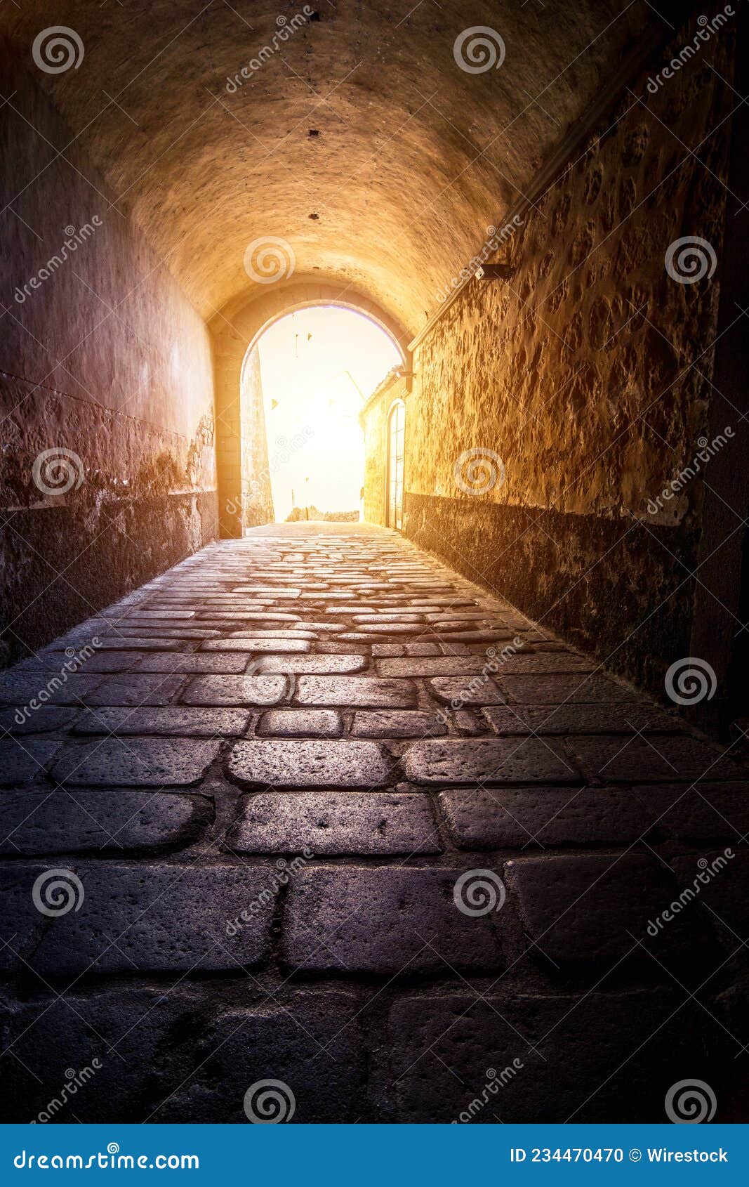 long tunnel on the sunshine background in casco antiguo, caceres, extremadura, spain