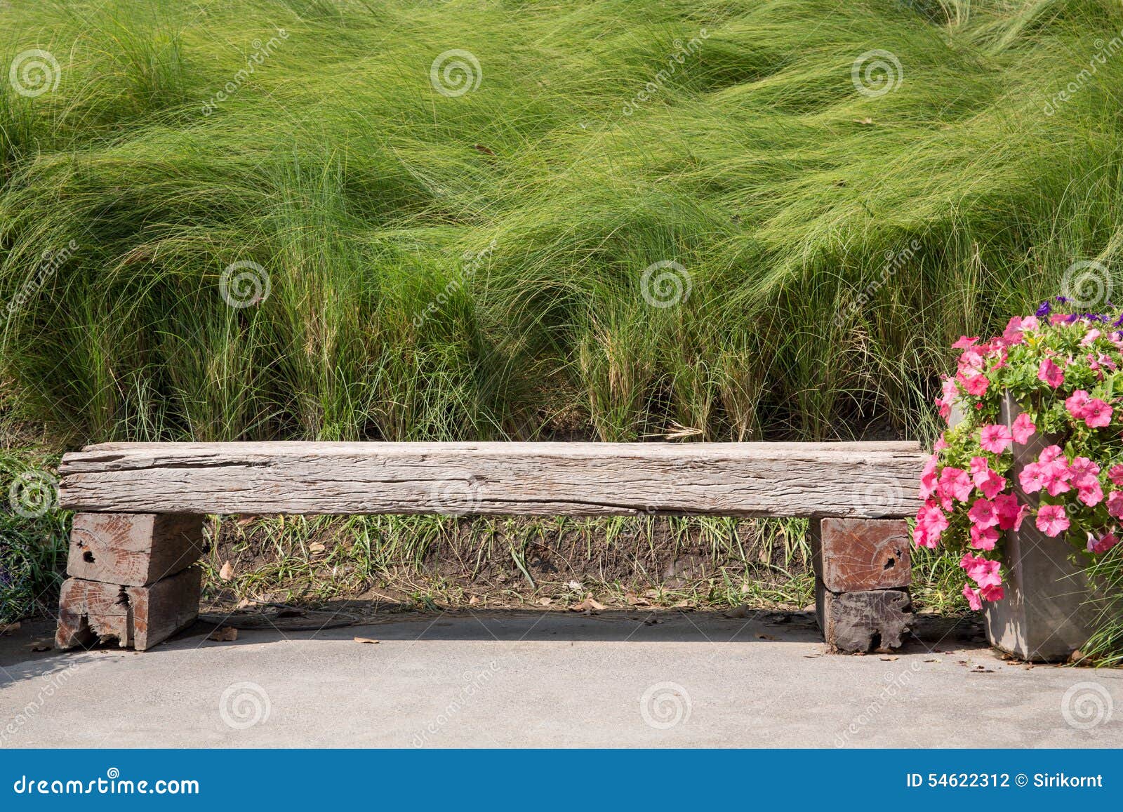 Long Wood Chair In A Garden Stock Photo - Image: 54622312