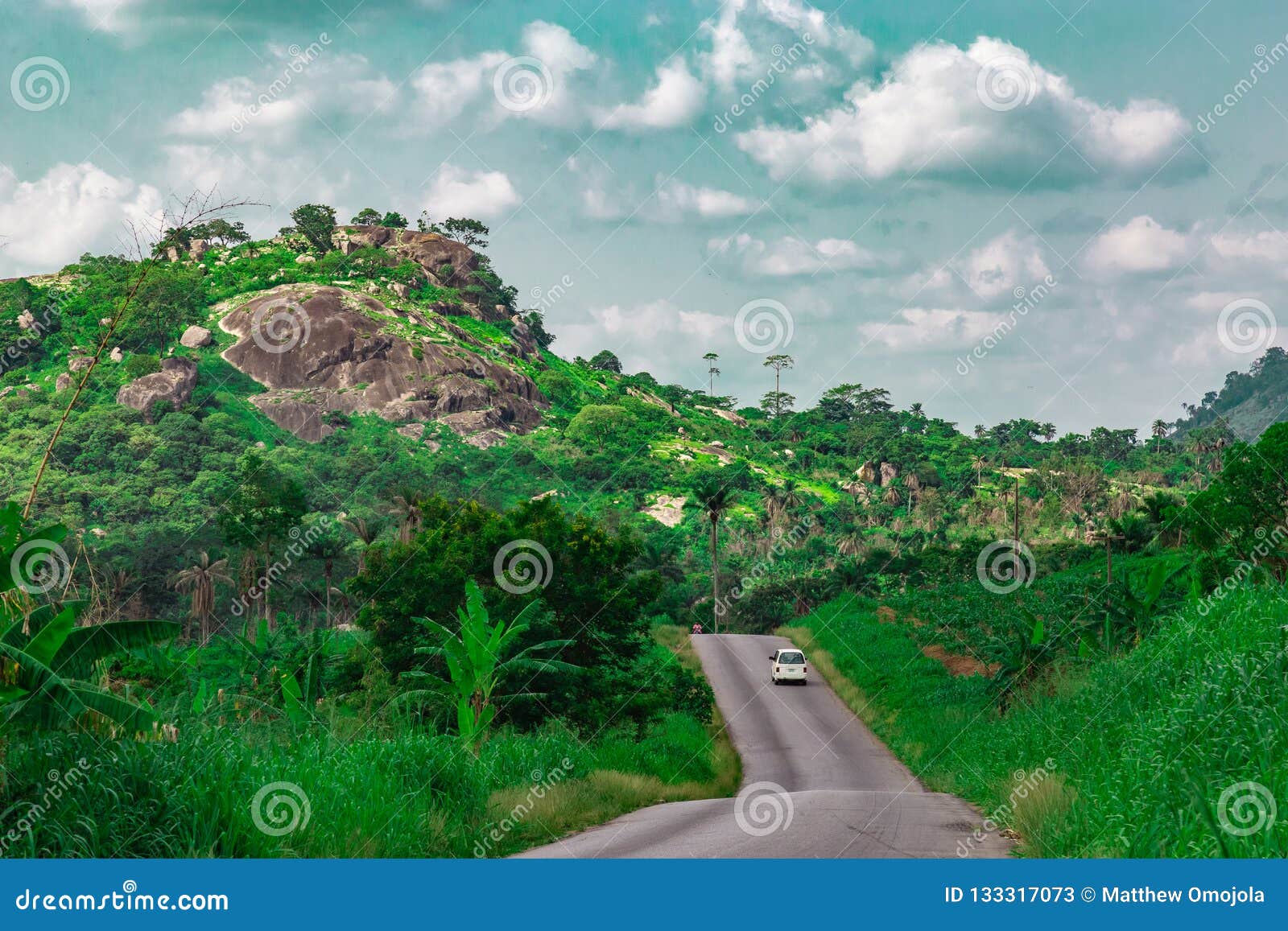 automobile on a longer section of a disappearing rural road ekiti state nigeria. disappearing road 