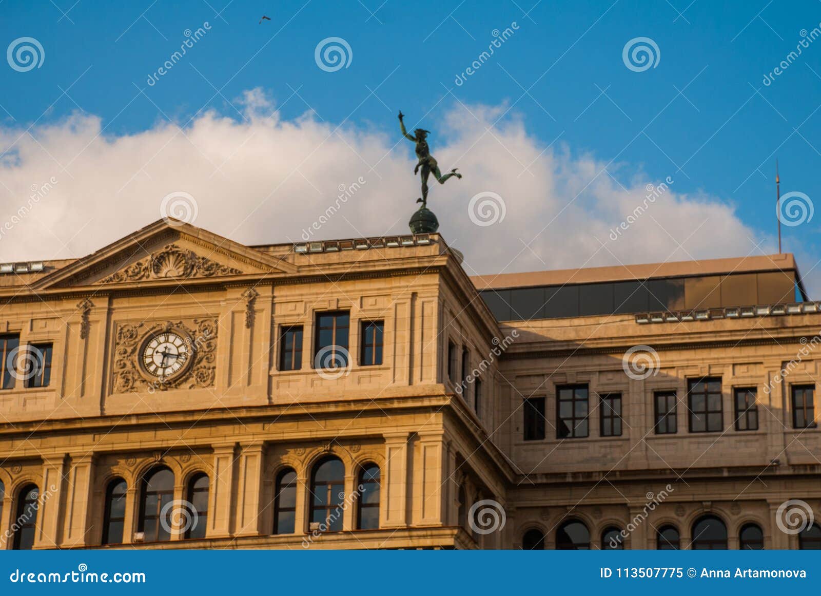 the building of lonja del comercio, stock exchange, now the offices of foreign companies. topped with a statue of mercury, the god