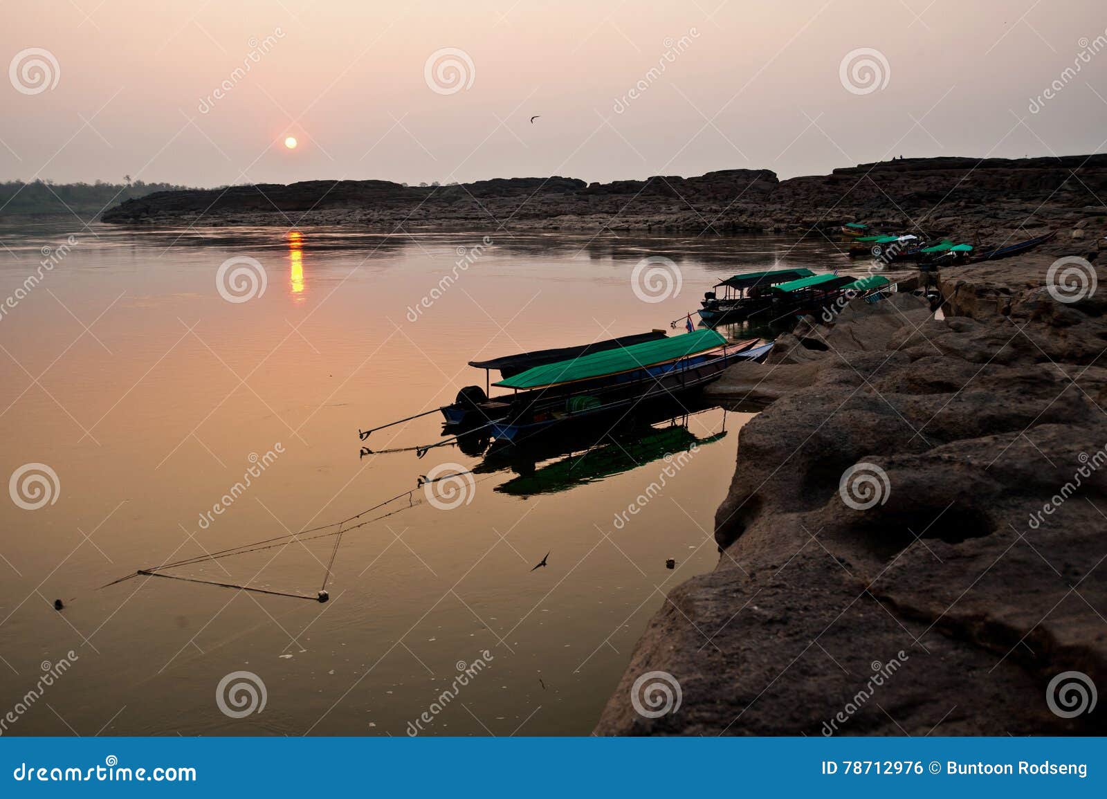 longtail boat, berth at sand sam pan bok grand canyon in maekhong river, northeast of thailand