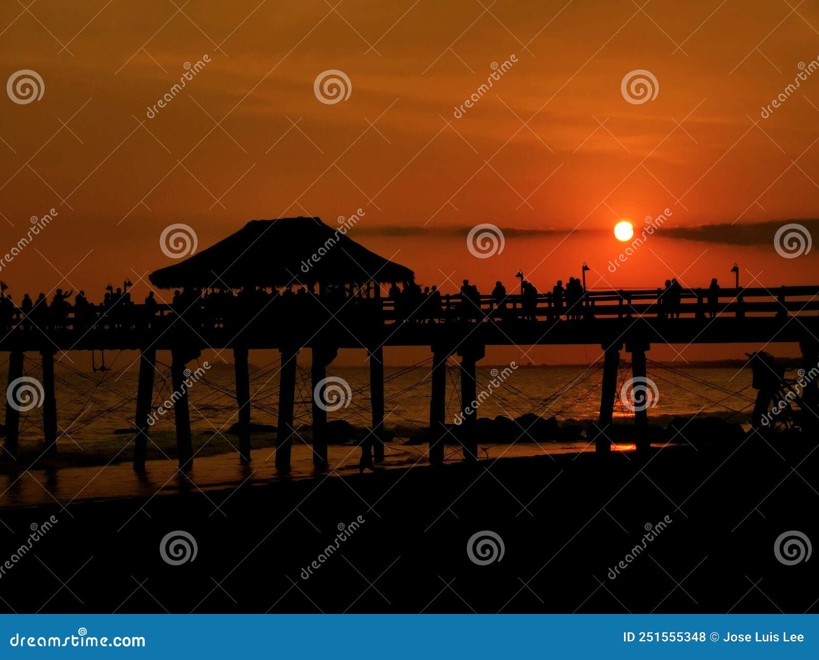 amazing beach sunset behind the pier