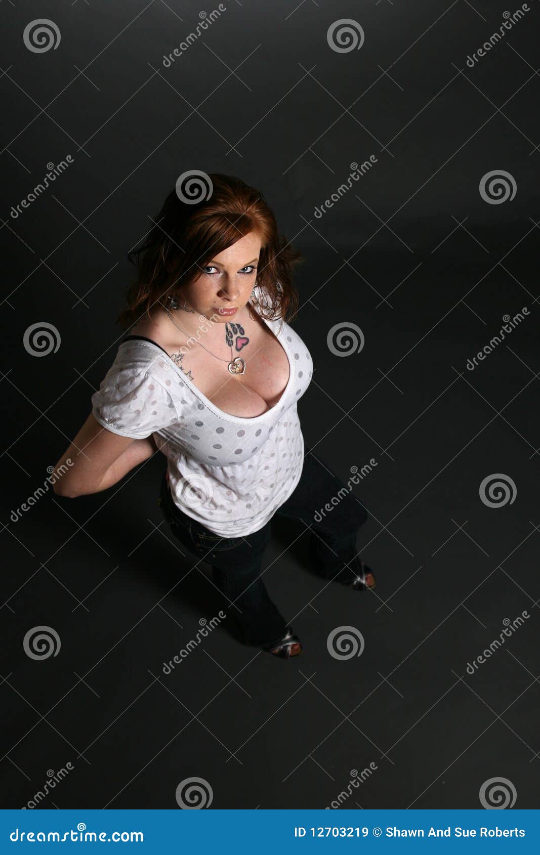 Looking Down on Pretty Woman with Large Breasts Stock Image