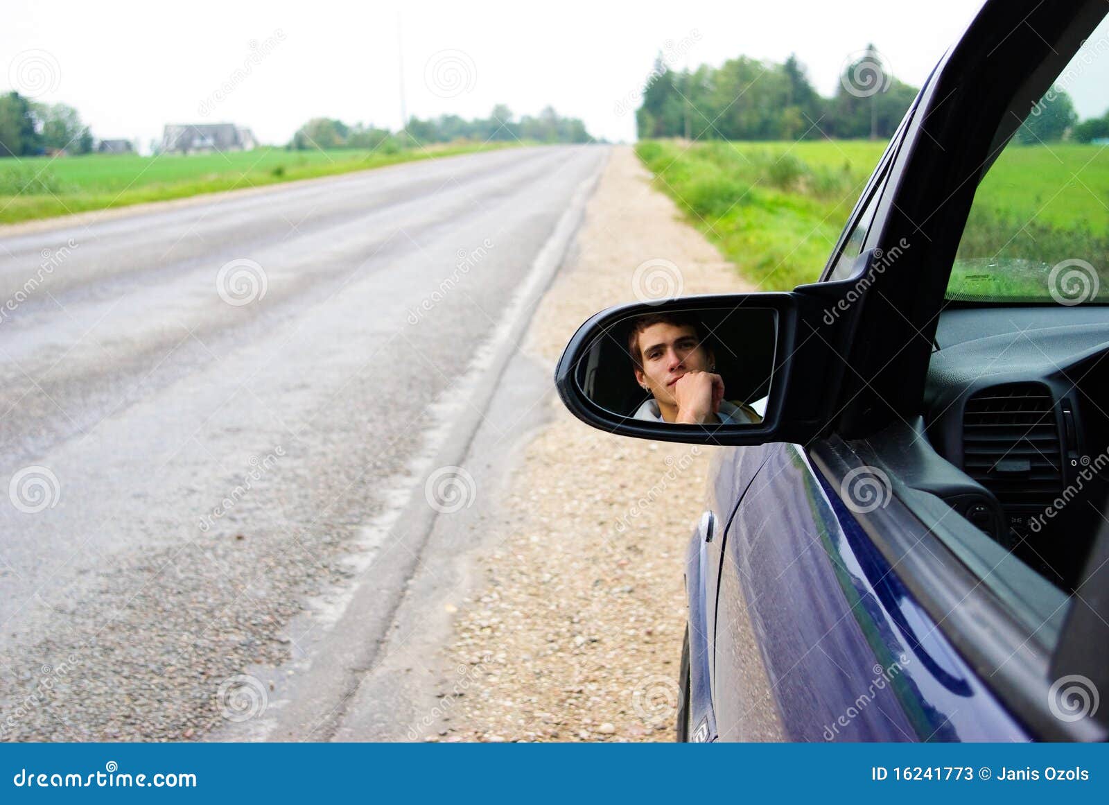 looking in rear view mirror