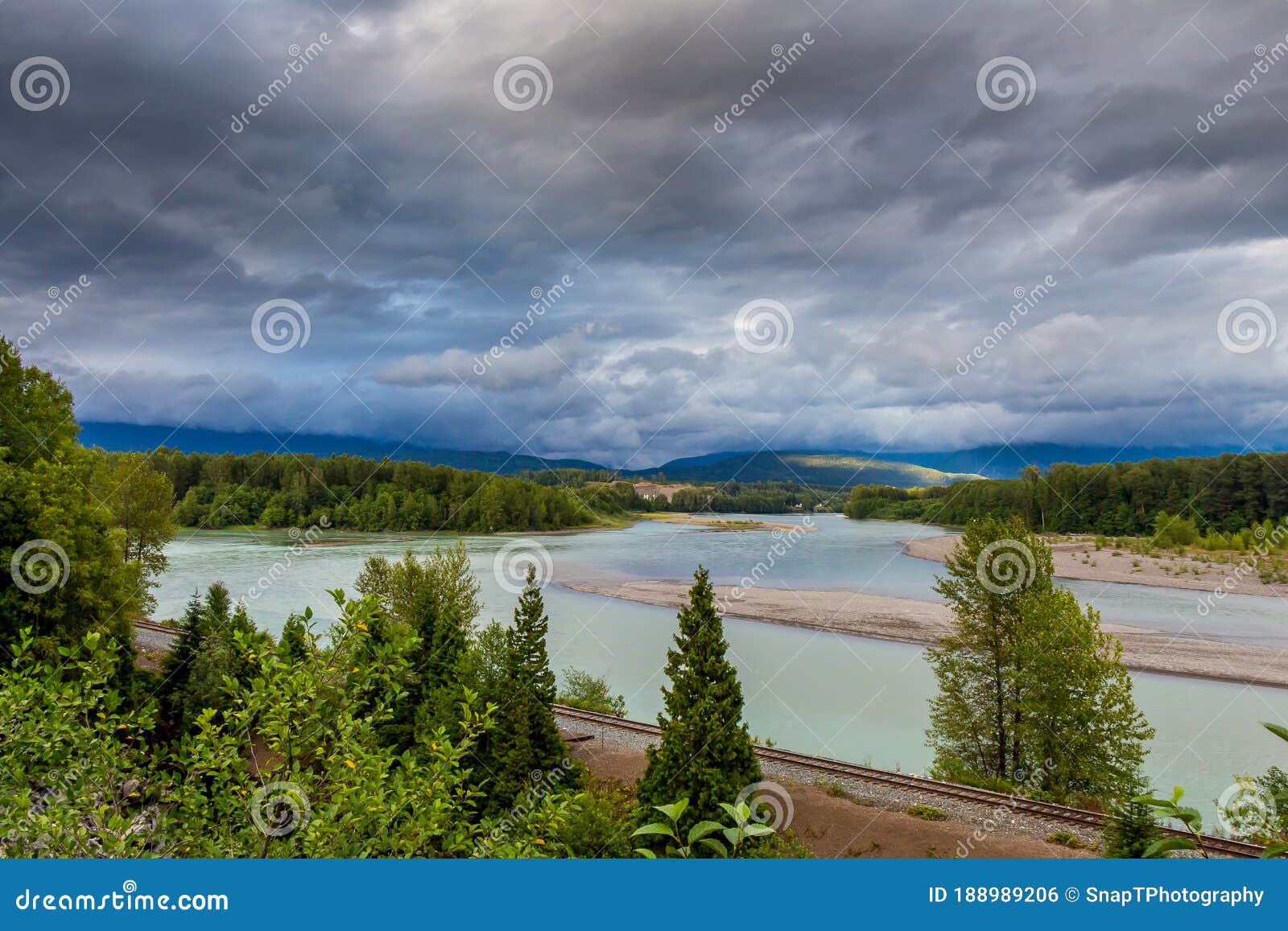 looking upstream on the skeena river towards terrace, at the kallum river confluence, beside the cn railway line