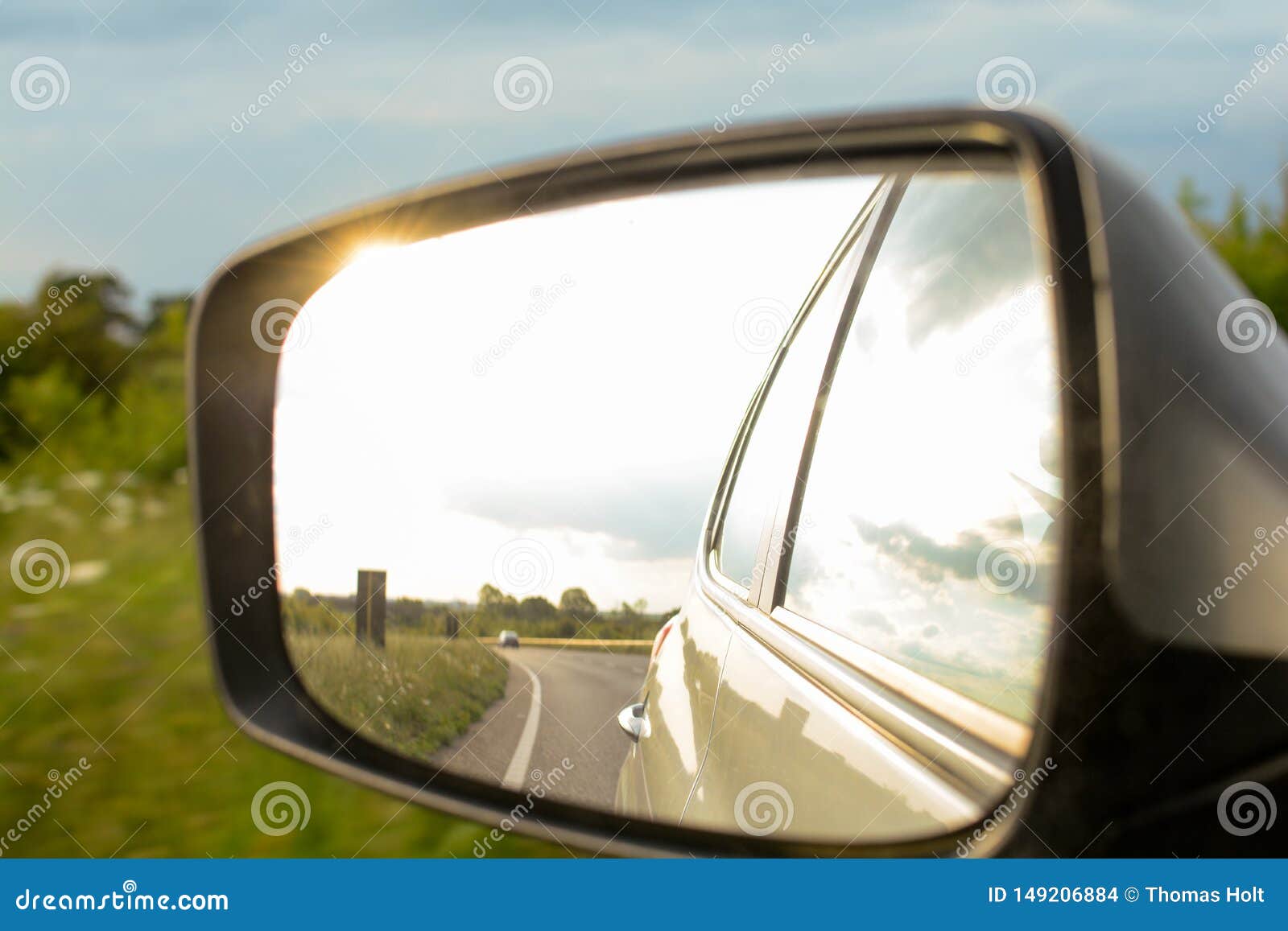 Looking in the Wing Mirror Whilst Driving in a Car Stock Photo Image