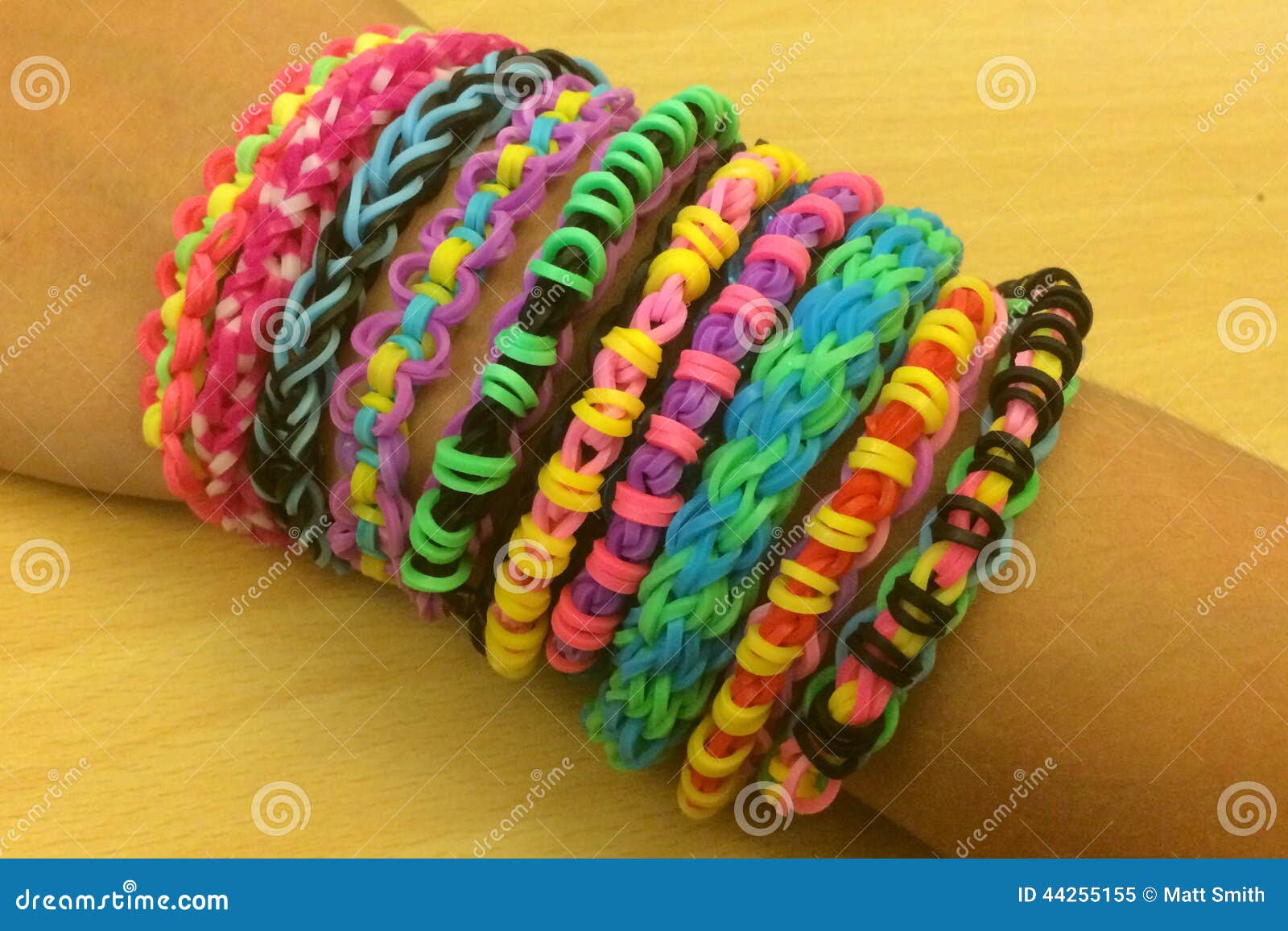 Young girl showing off rainbow loom band bracelets on her wrist Stock Photo  - Alamy