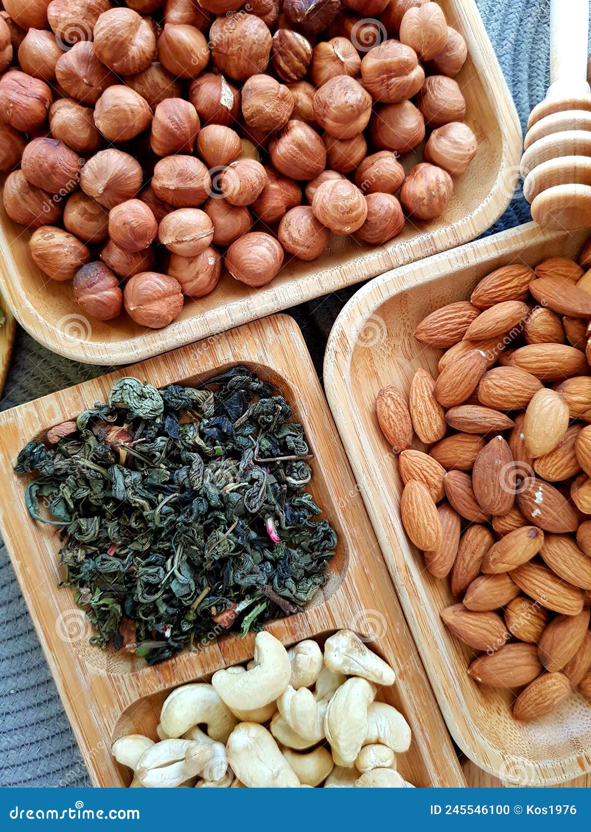 Leafy green tea and nuts stock photo. Image of background 245546100