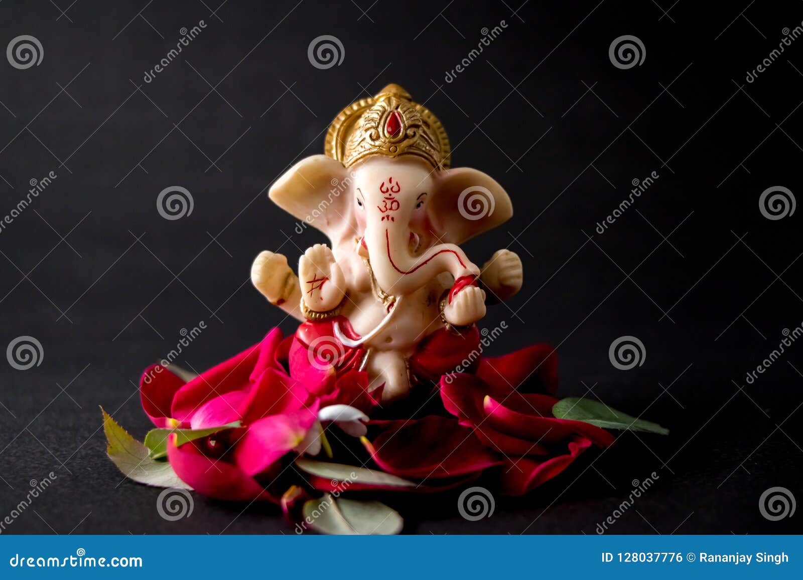 Lord Ganesha Idol with Rose Petals, White Flowers and Leaves on ...