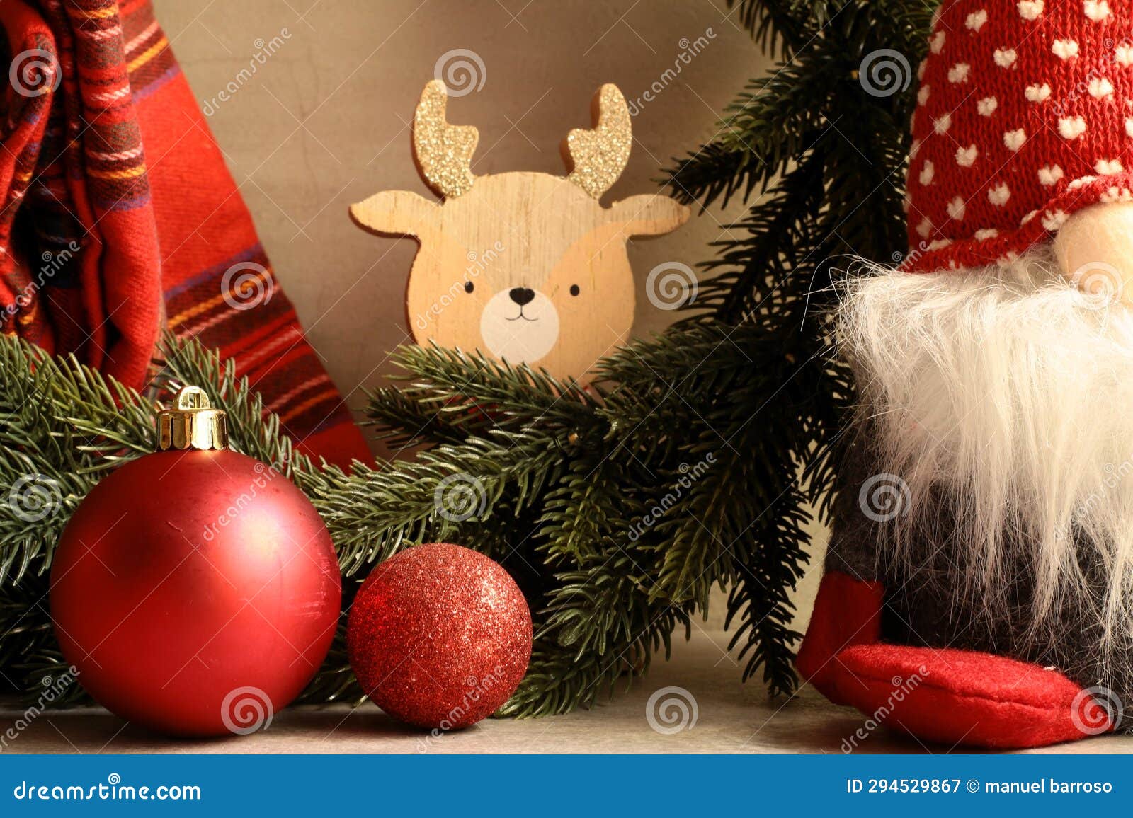 red christmas balls and wooden reindeer