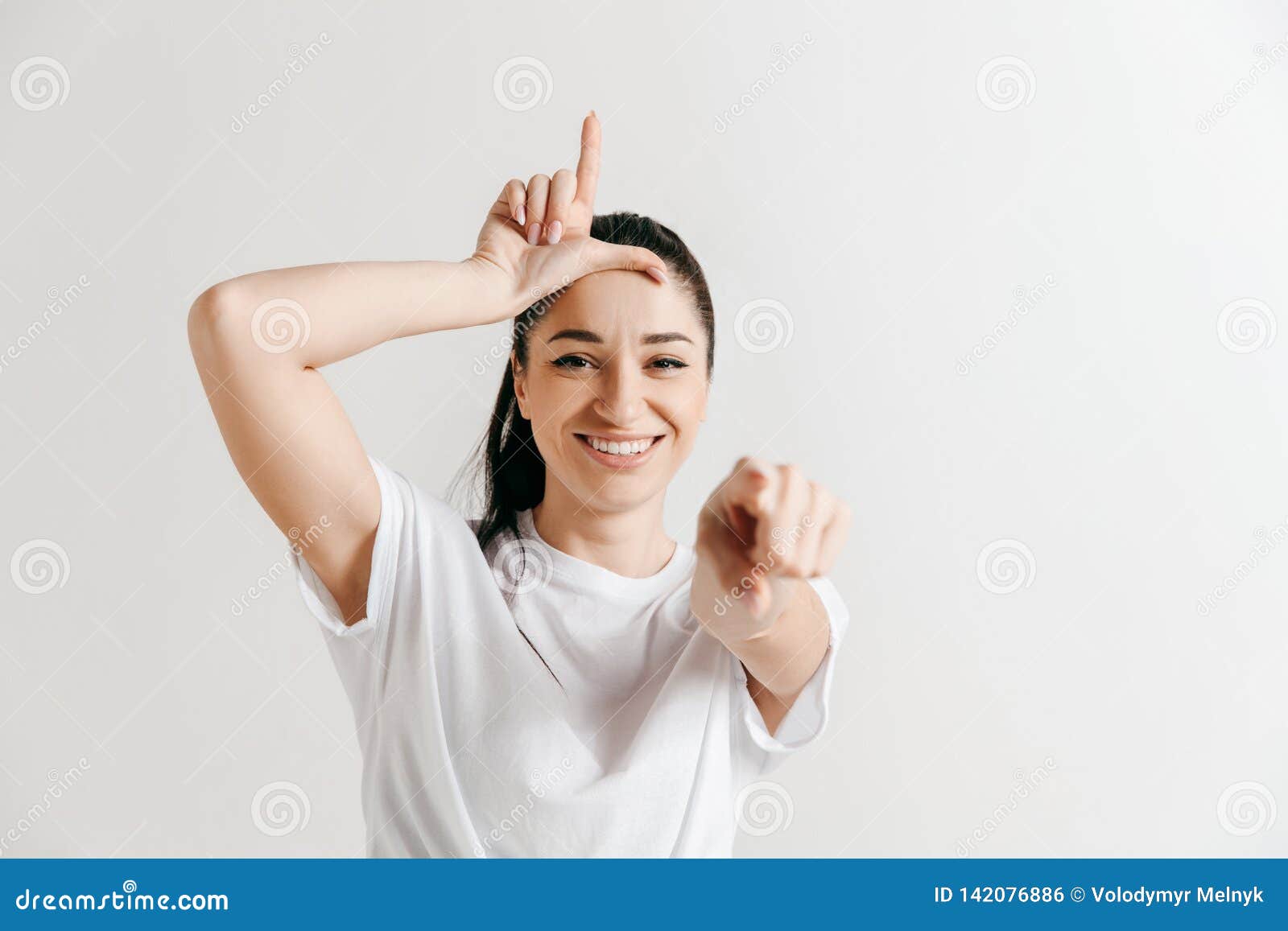 Losers Go Home. Portrait of Woman Showing Loser Sign Over Forehead Stock  Photo - Image of indoor, girl: 142076886