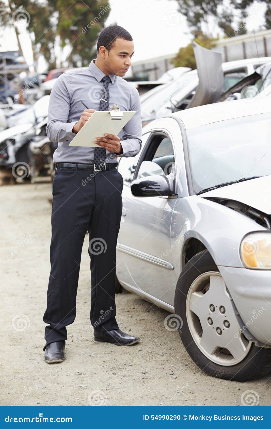 Loss Adjuster Inspecting Car Involved in Accident Stock Photo Image