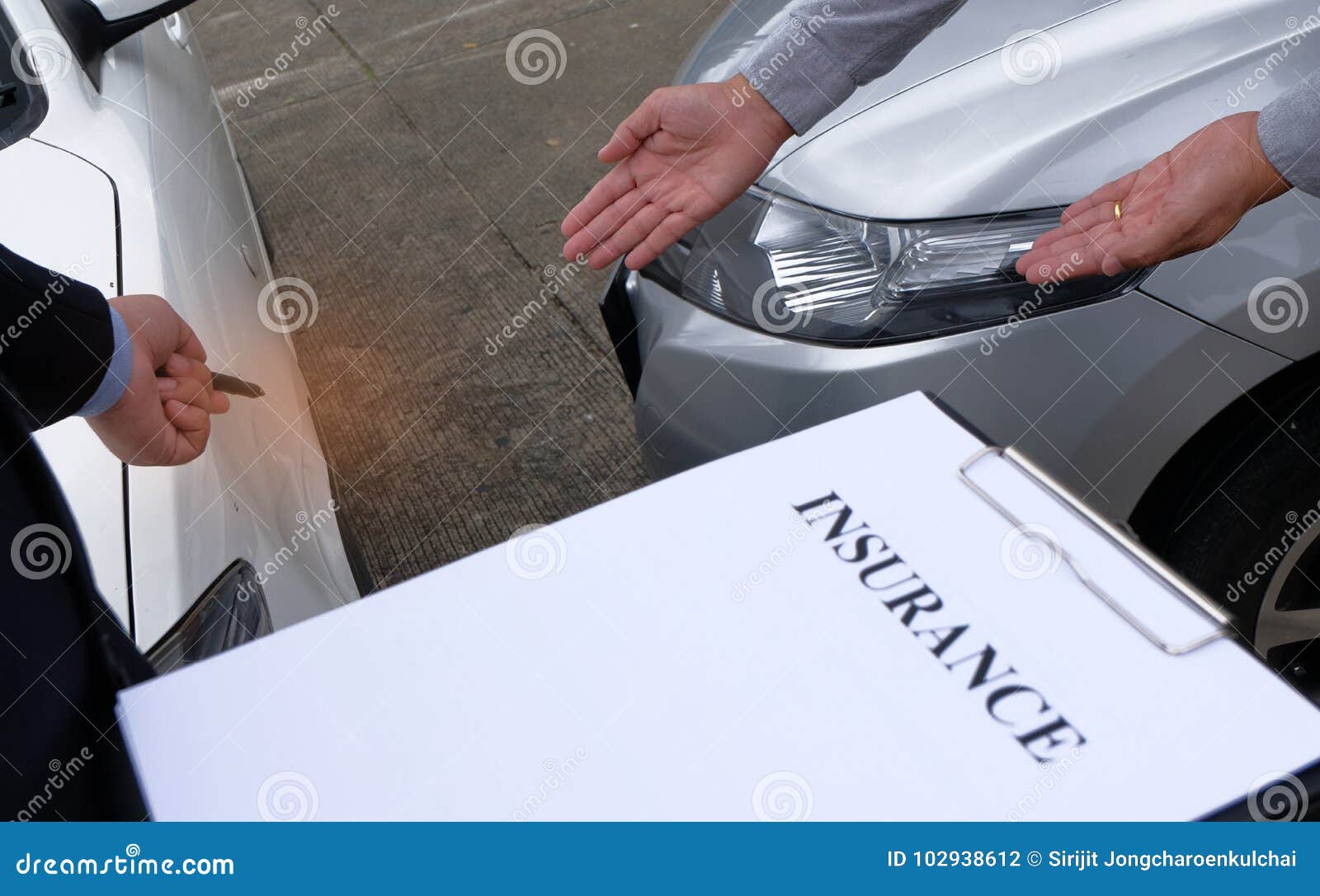 Loss Adjuster Insurance Agent Inspecting Damaged Car. Stock Photo