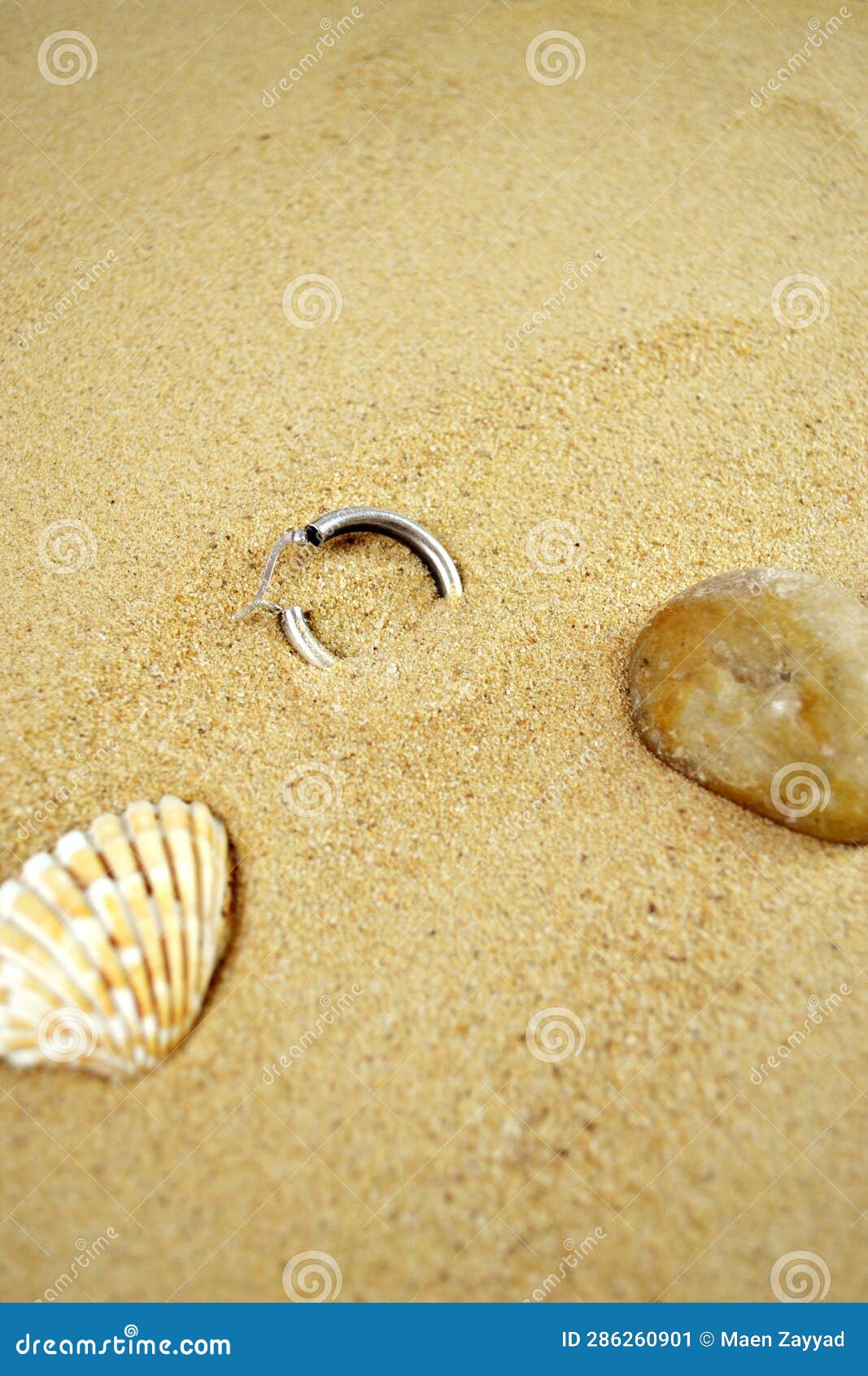 Lost earring at the beach stock image. Image of natural 286260901