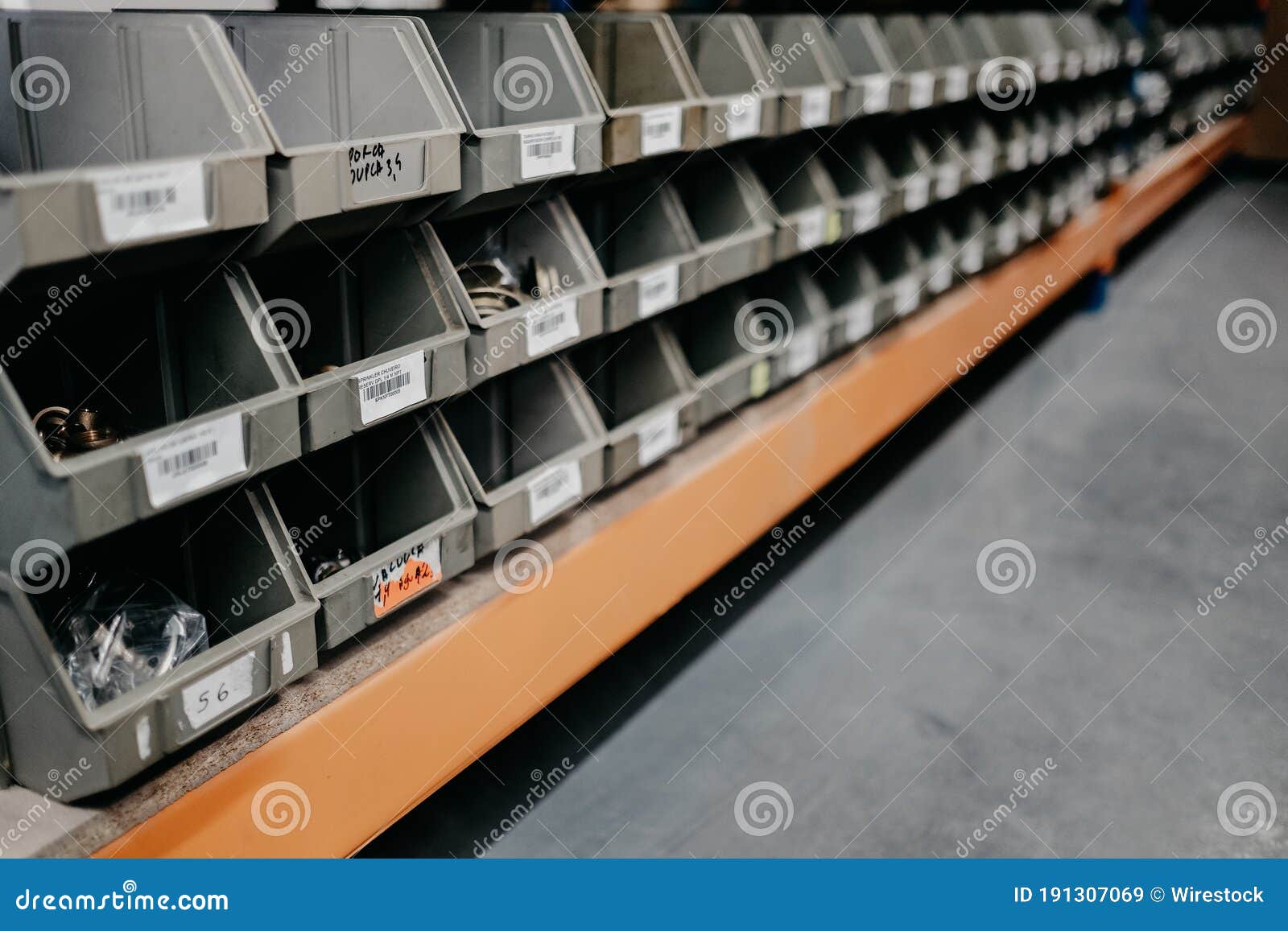 Lot of Empty Storage Bins with Price Tags in a Store Stock Image