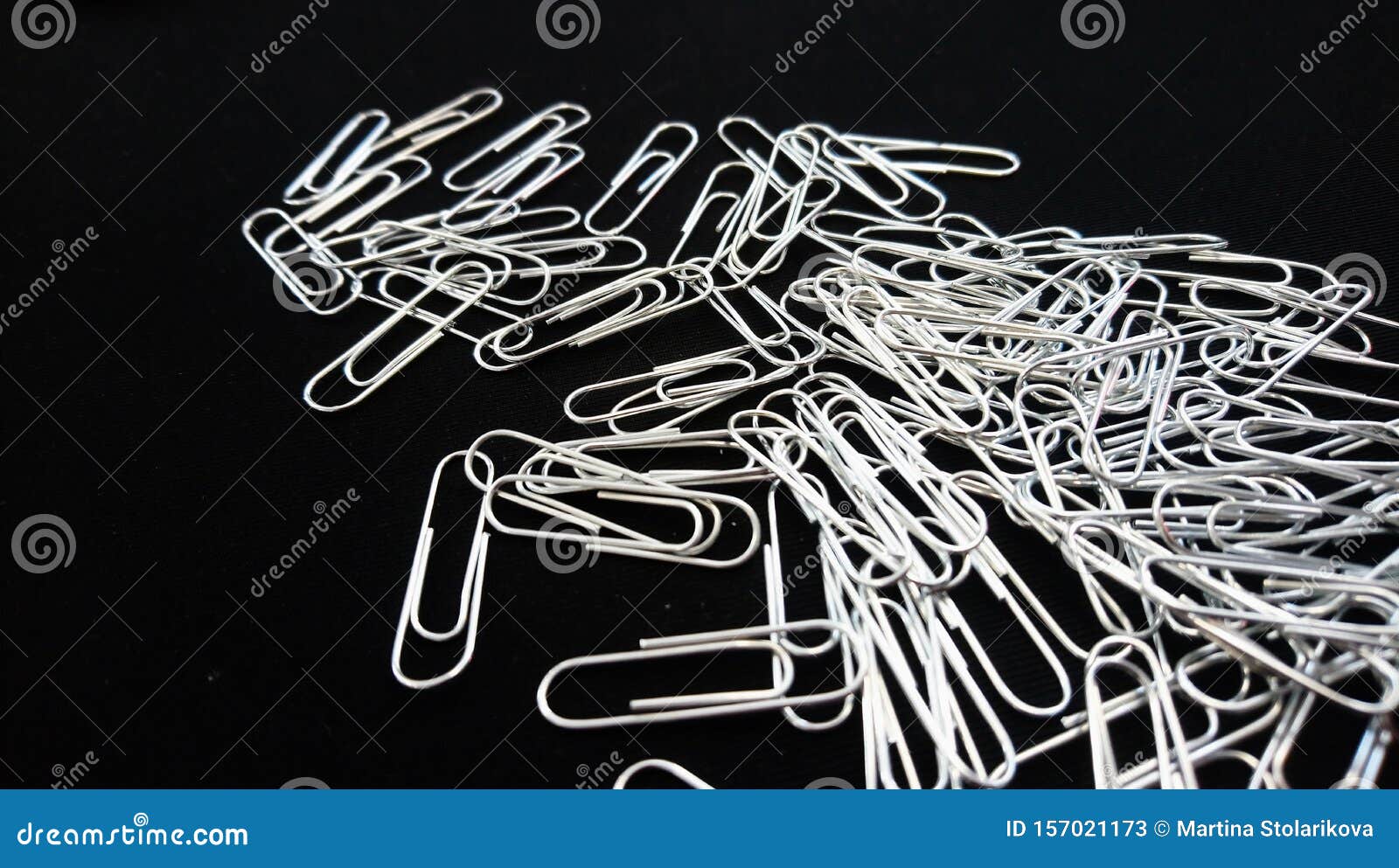 A Lot Of Paper Clips On The Black Background Stock Image - Image of ...