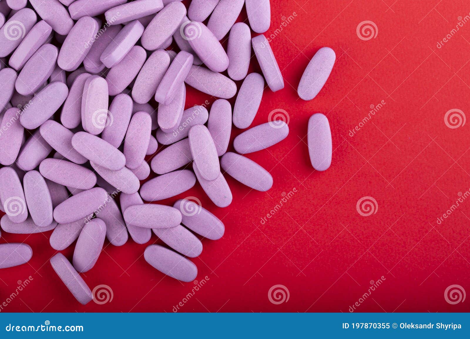 a lot of pink medicine pills. space for text. medicine creative 