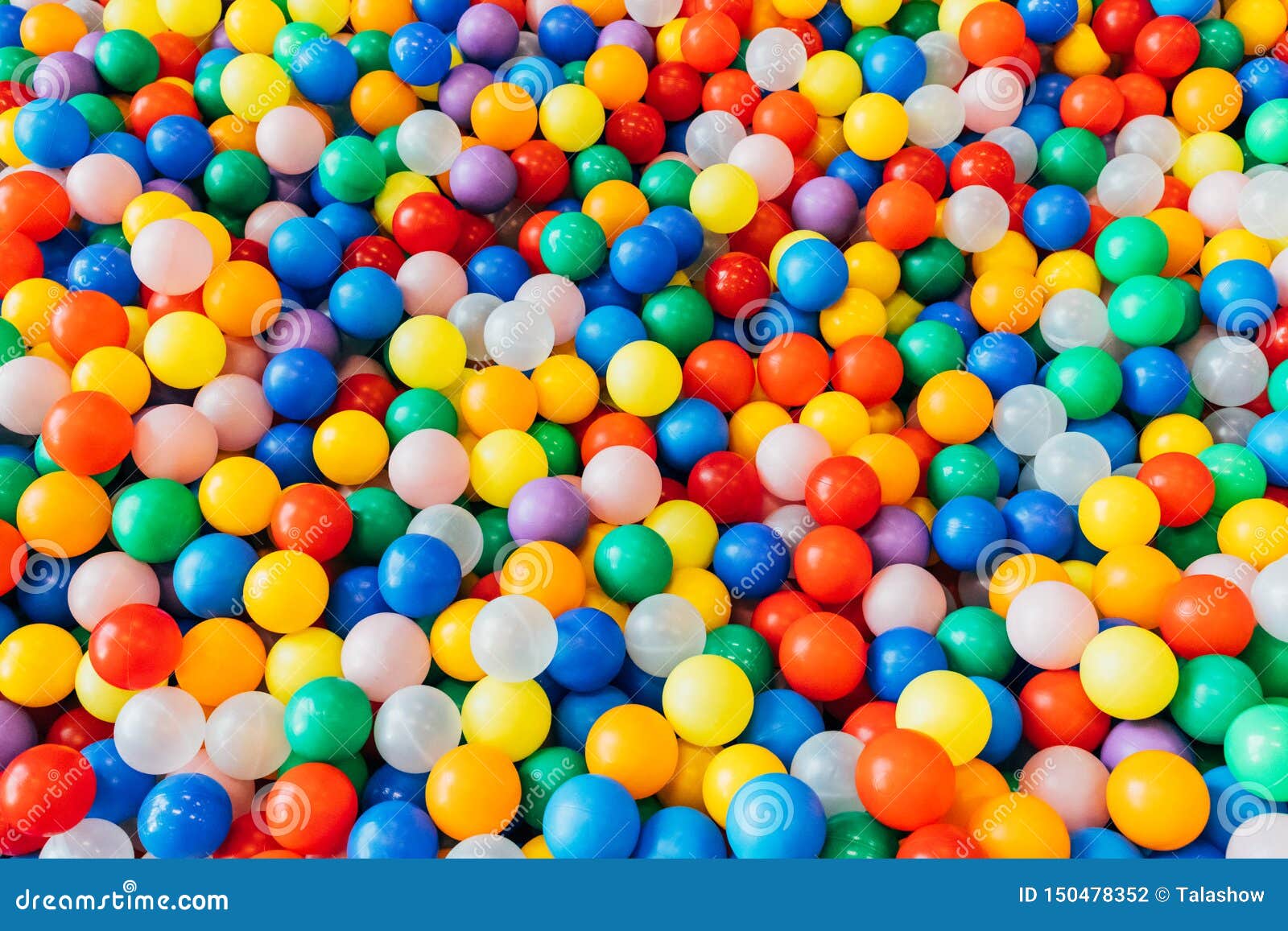 Lot of Plastic and Colored Balls in a Chaotic Manner Stock Photo
