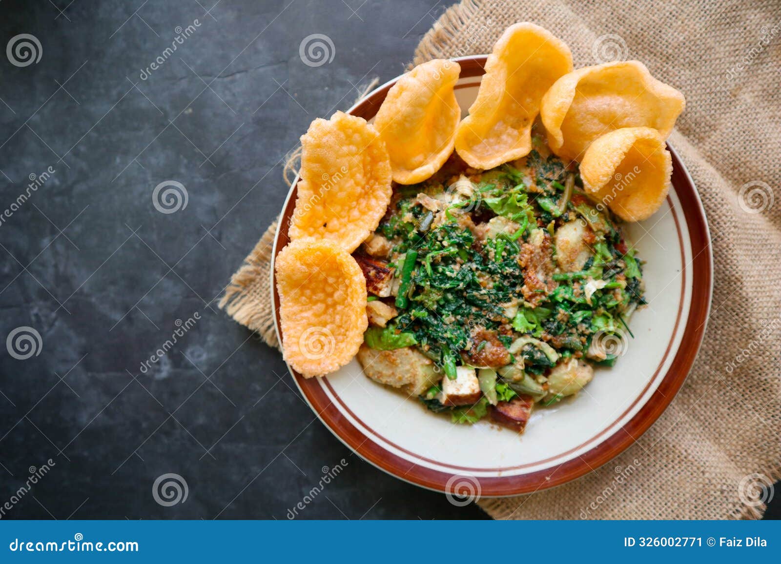 lotek is a traditional salad from indonesia made from vegetable, chayote, kale, young jackfruit, tempeh, tofu, long beans, and