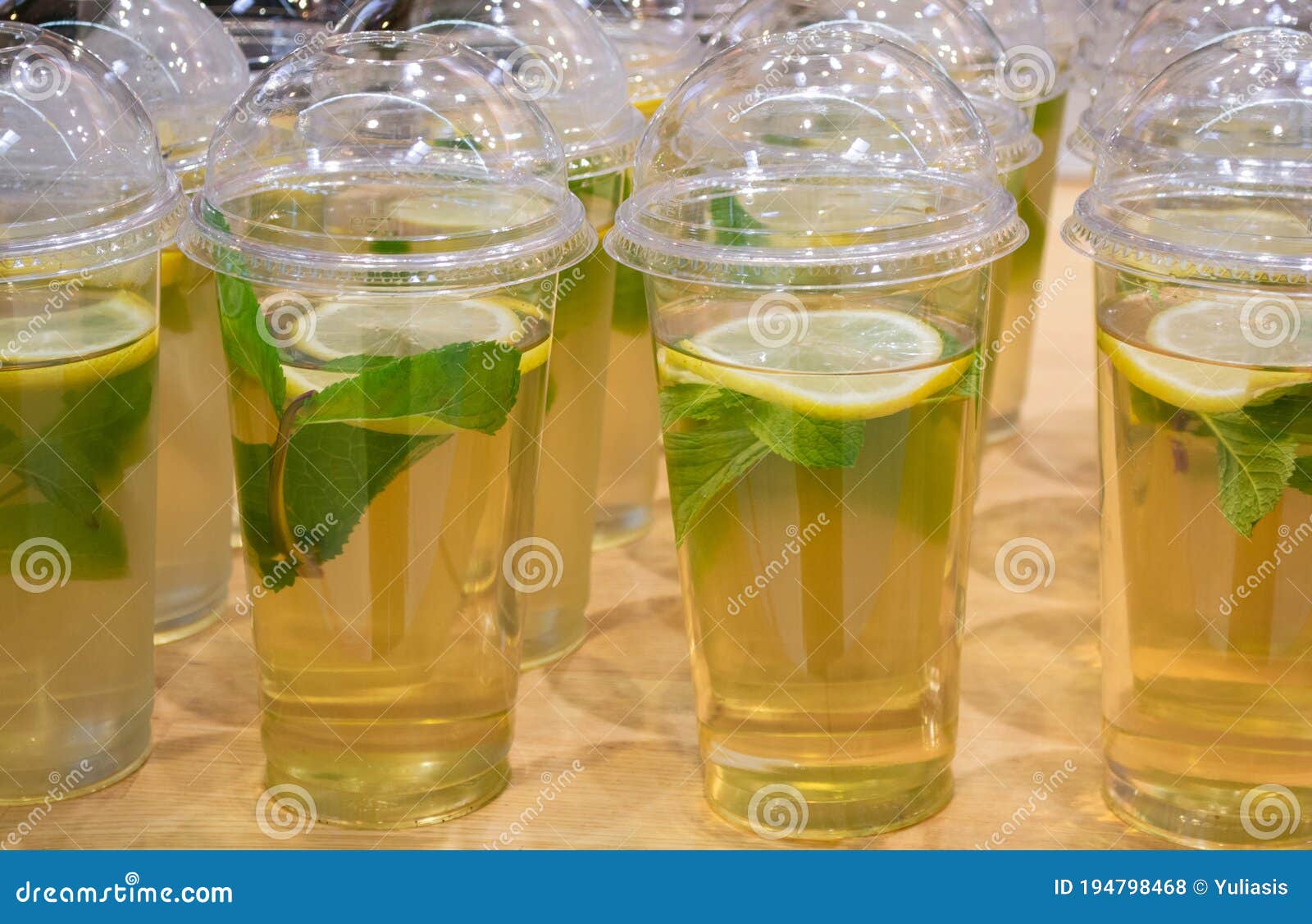 Lots of Clear Plastic Cups with a Lid and Lemonade, or Green Tea with