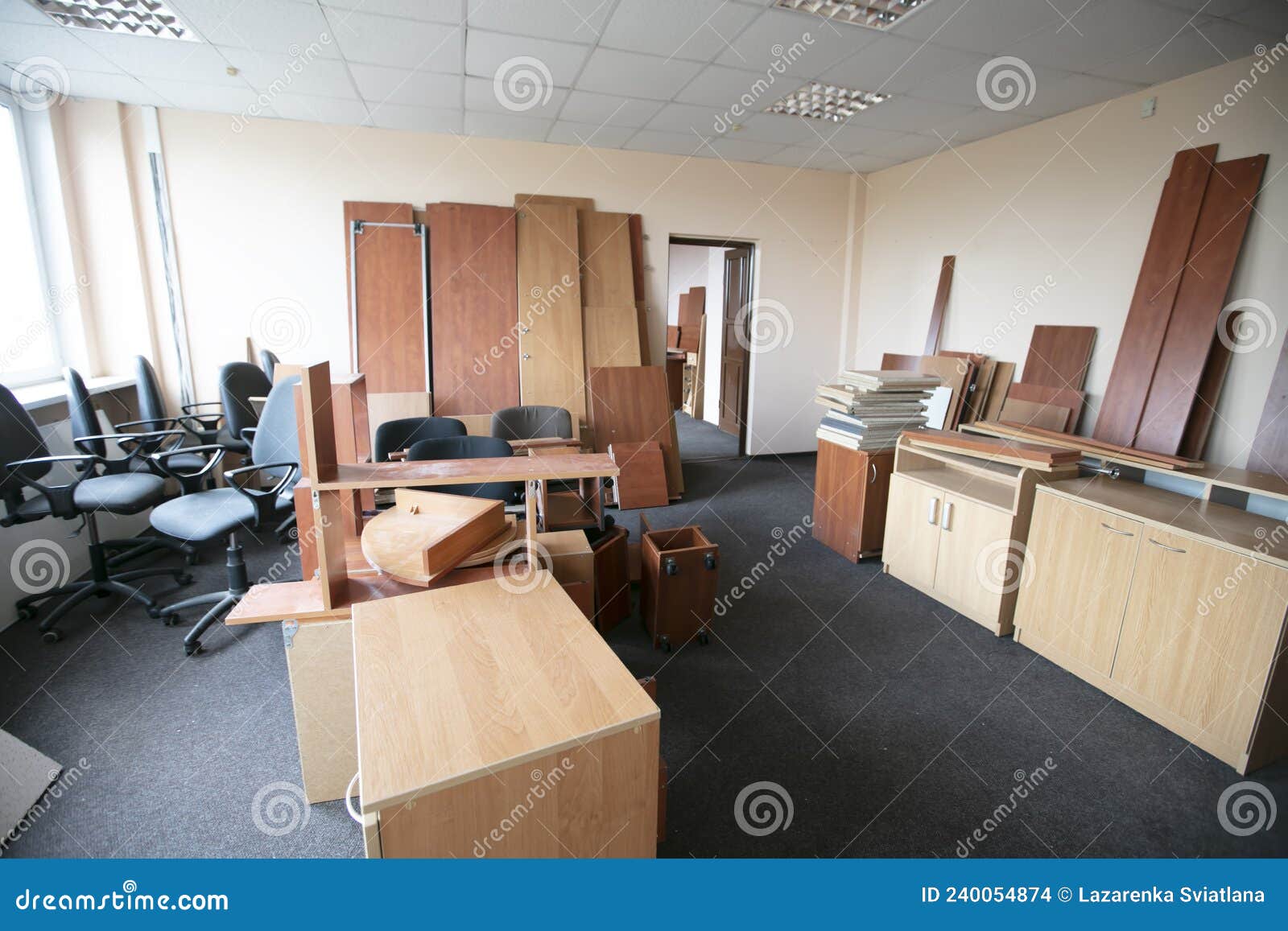 Lots of Disassembled and Scattered Office Furniture Stock Photo Image