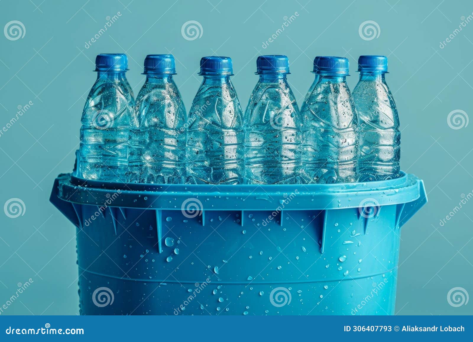 Lots of Plastic Bottles in a Bucket on a Blue Background Stock Image