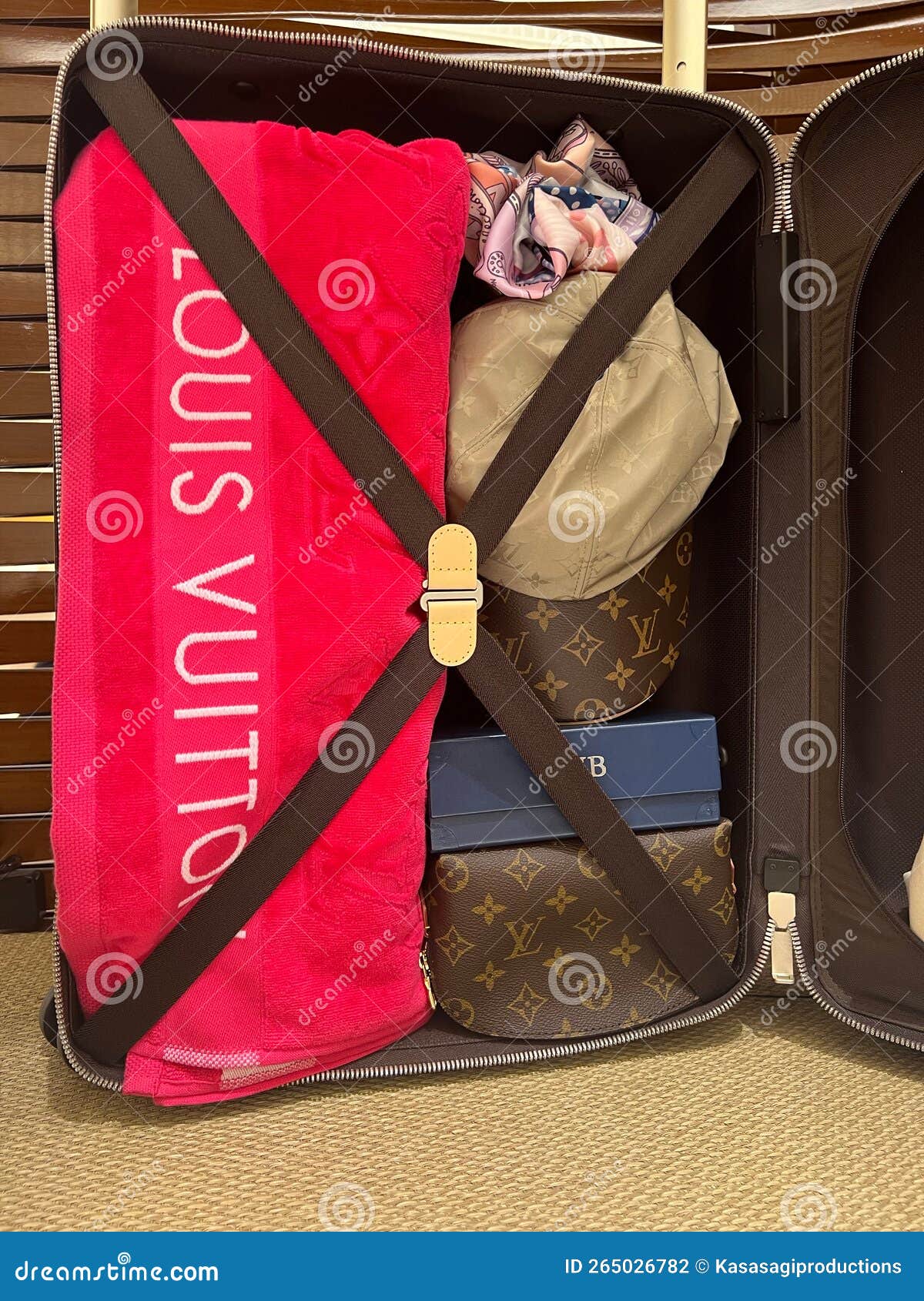 Louis Vuitton Designer Accessory Set Including Towel, Scarf, Cap and  Suitcase Editorial Photography - Image of canvas, expensive: 265026782