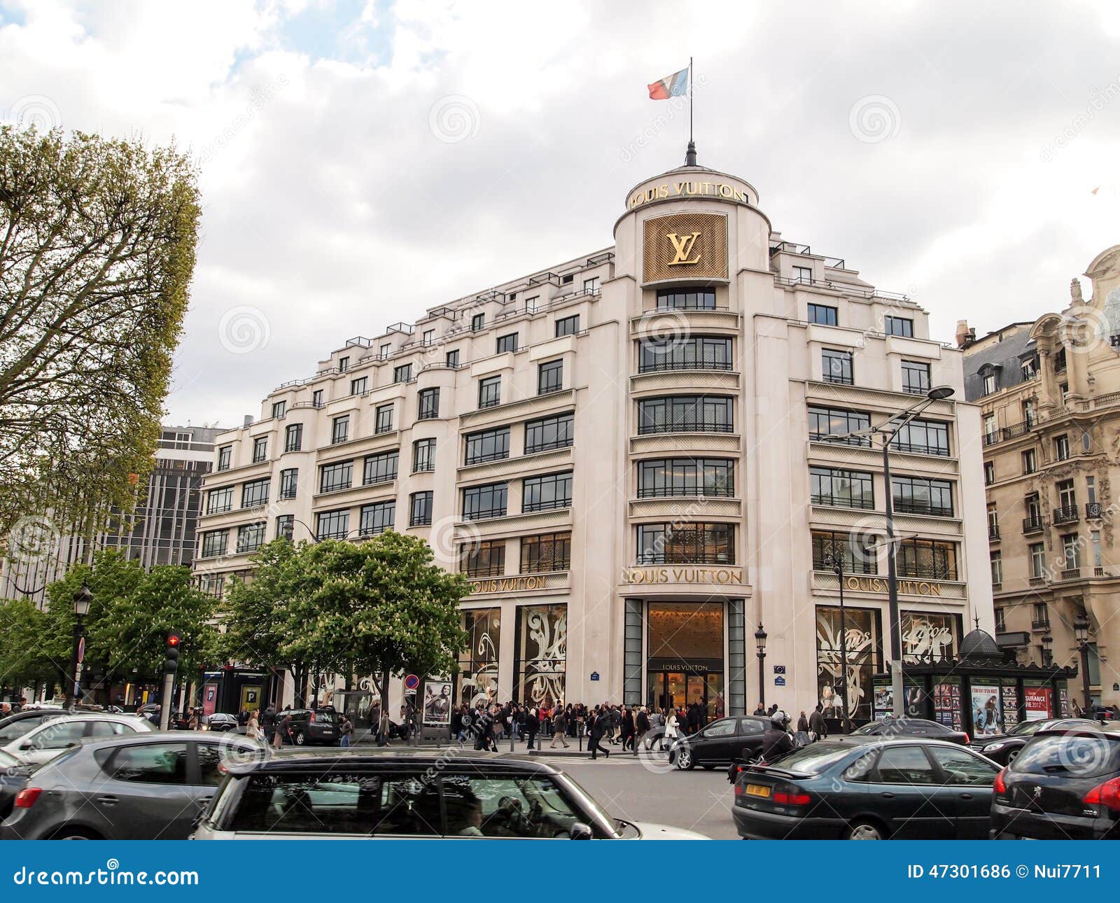 PARIS-APR 14: Customers are on queue to enter Louis Vuitton shop at Champ  Elysee avenue