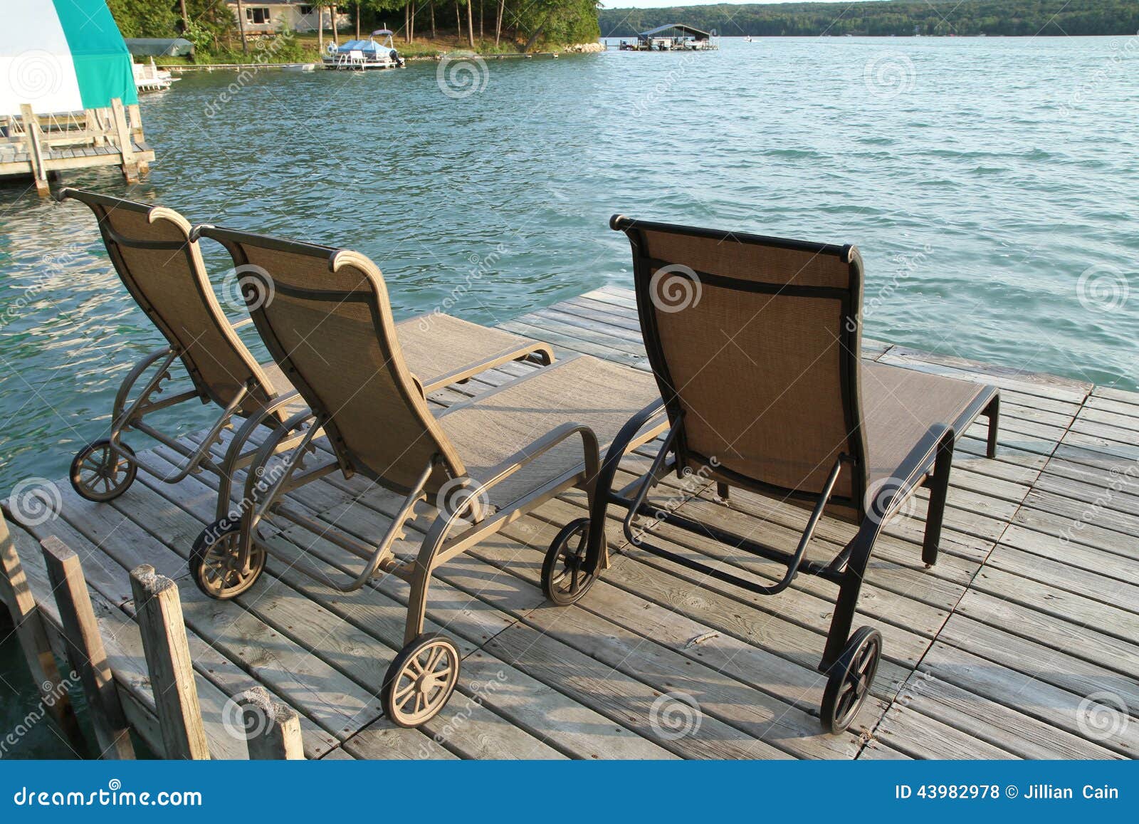 Lounge Chairs on a Lake Front Dock Stock Photo Image of peace