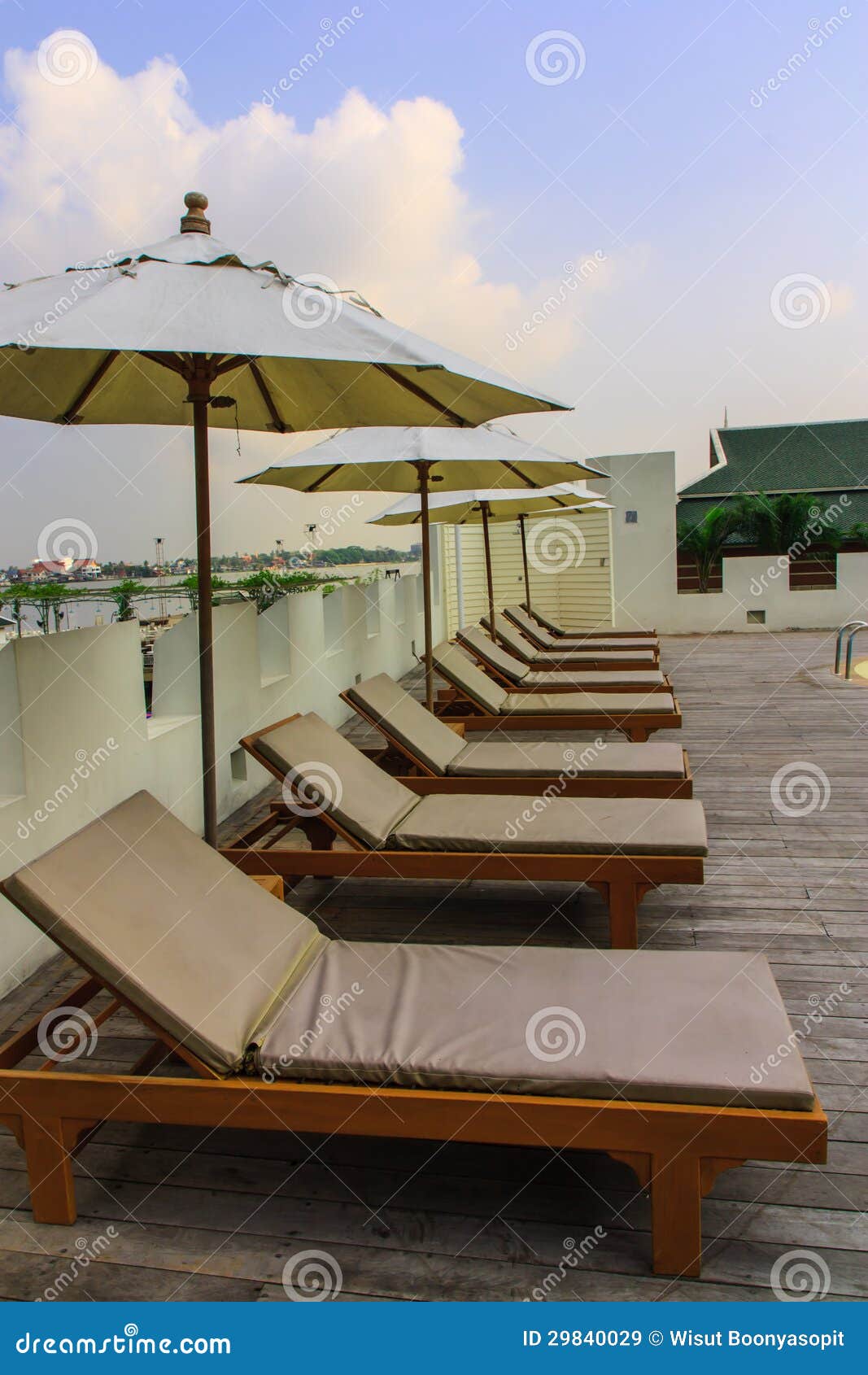 Lounge chairs by the pool stock image. Image of chaise 29840029