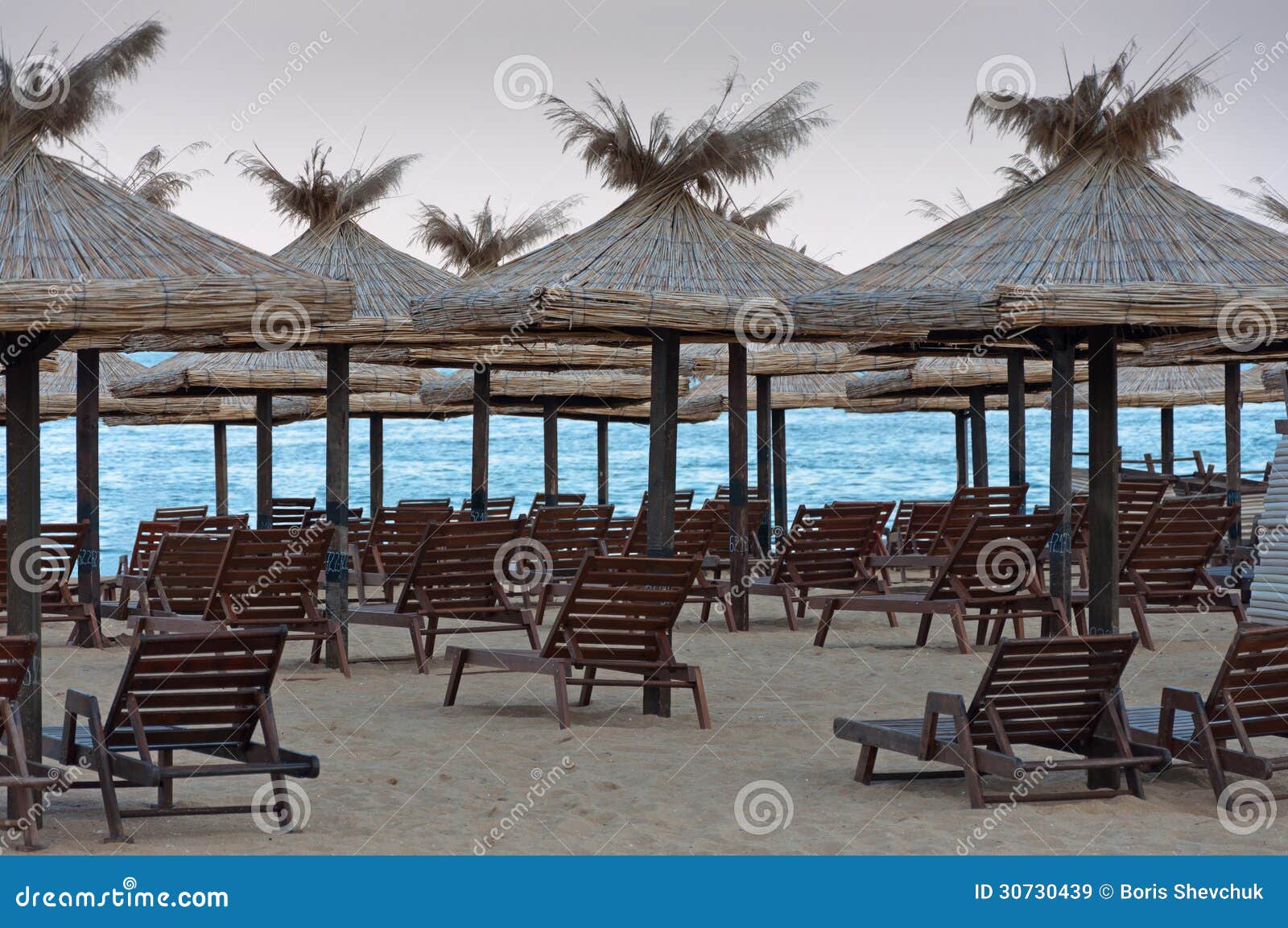Lounge Chairs with a Sun Canopy on the Beach. Stock Image Image of