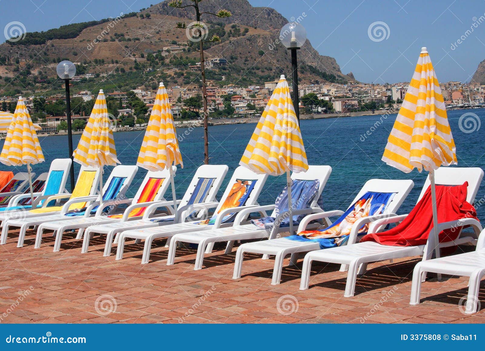 Lounge Chairs and Umbrellas Stock Photo - Image of shoreline, patio
