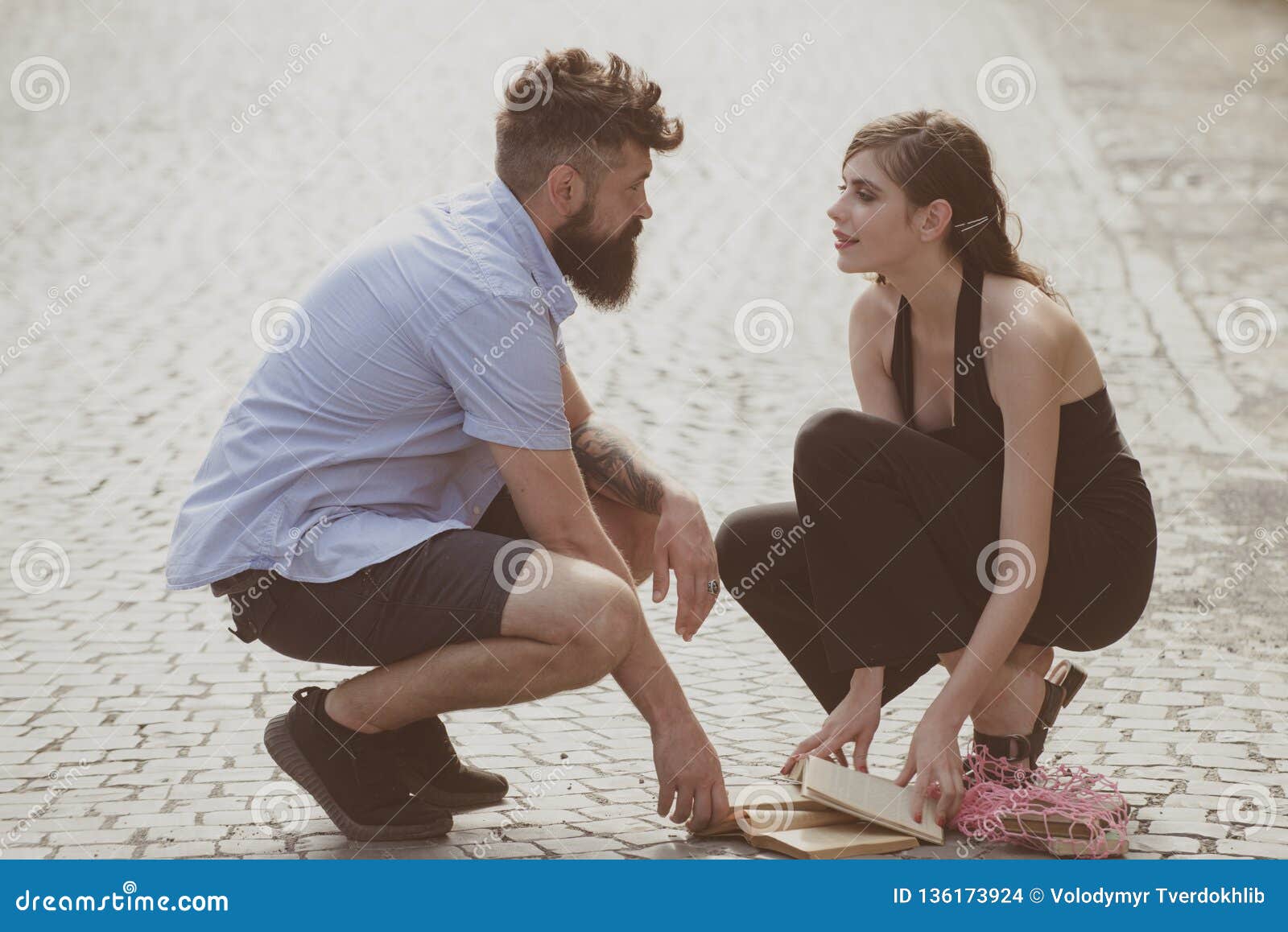 love at first sight. man and woman falling in love. bearded man and cute woman met on street. hipster helping and