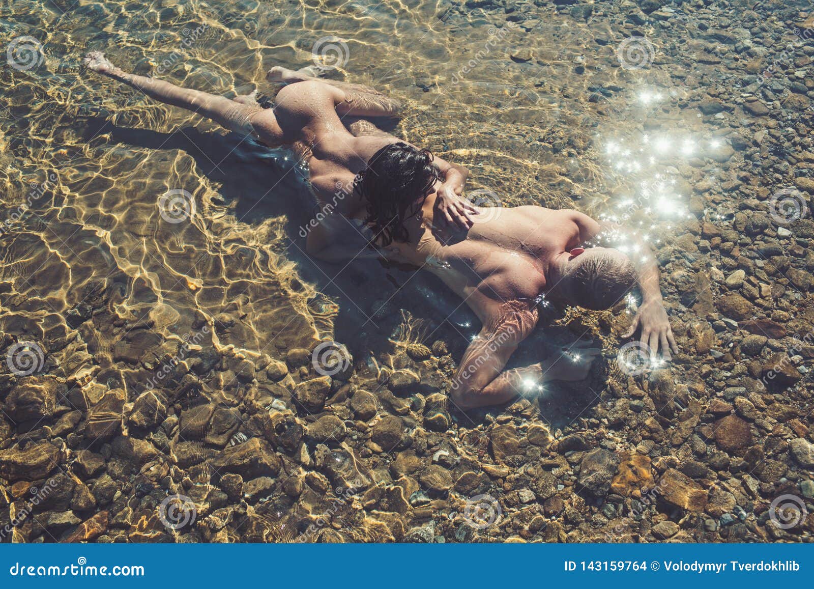 Appealing naked babes are relaxing on the beach