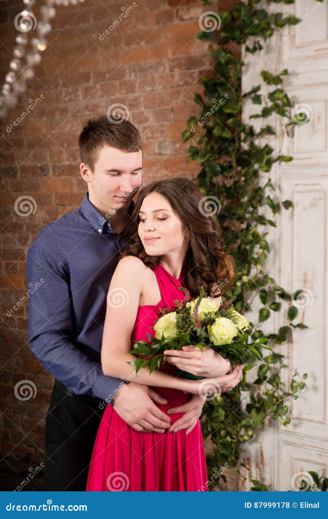 Love Story Romantic Couple with Flowers. Woman in Pink Dress Stock ...