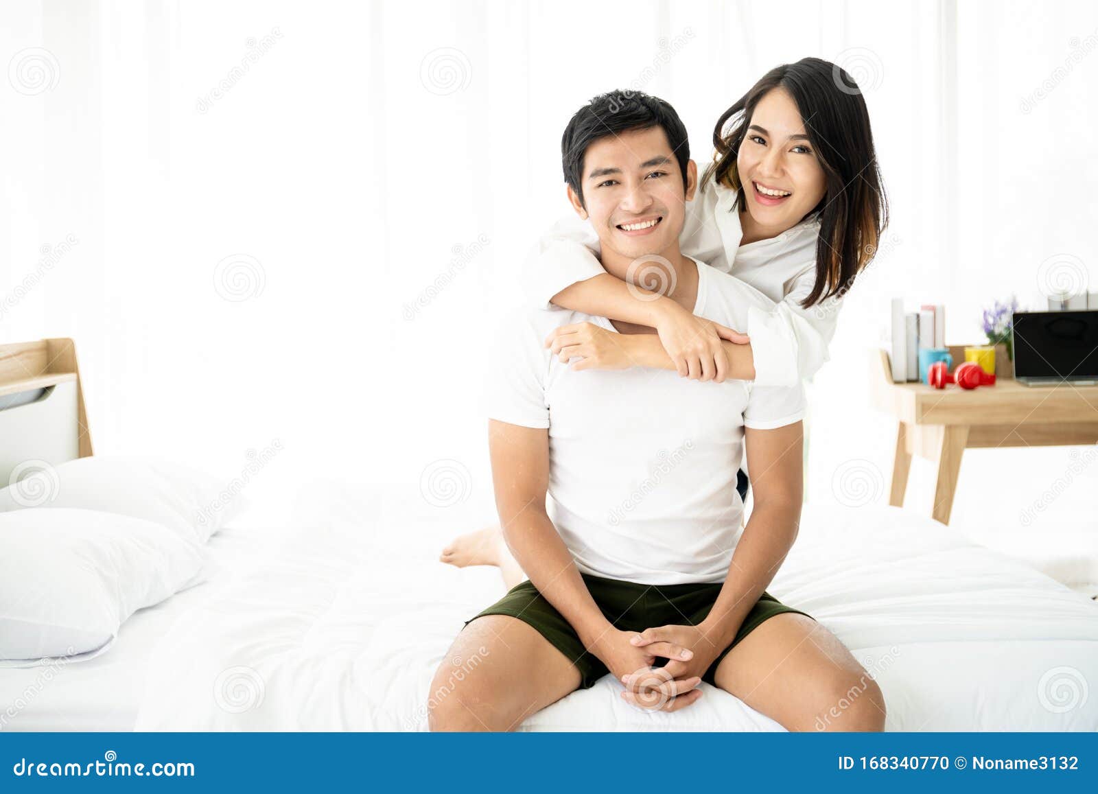 Lovely Asian Young Couple in Bedroom Stock Photo pic