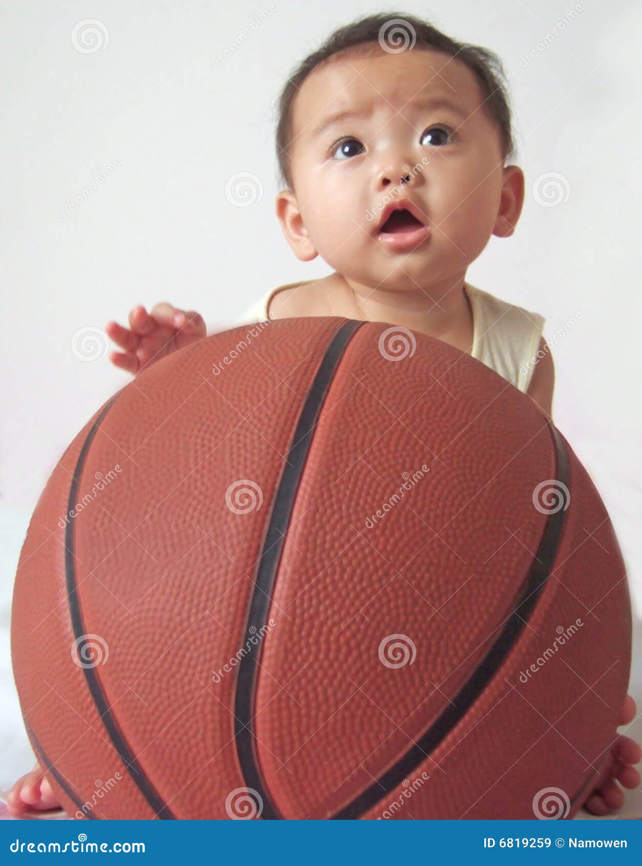 Lovely baby and basketball stock image. Image of eyes 6819259