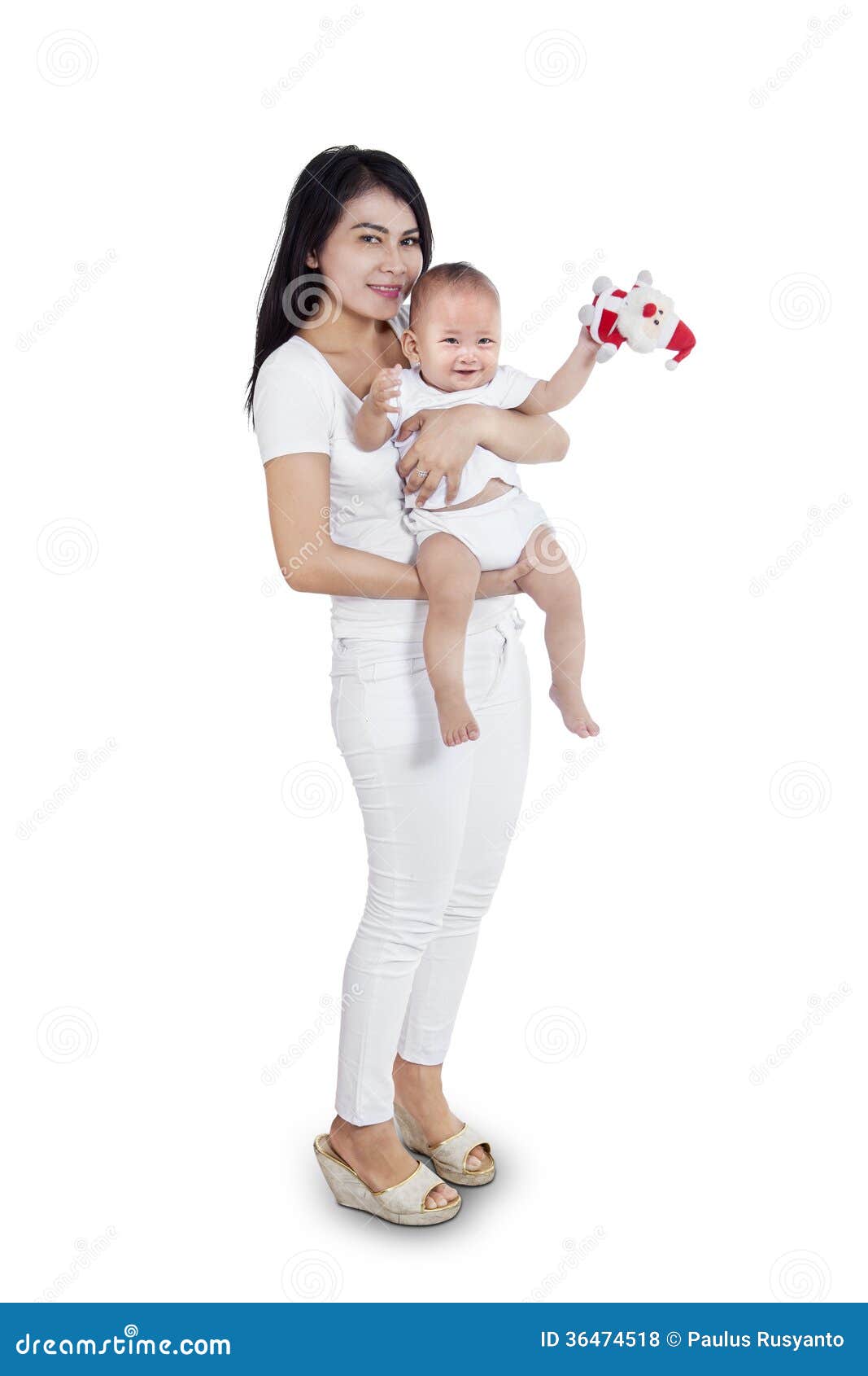 Lovely baby and his mother. Full-length portrait of a smiling mother with baby on hands - isolated on white