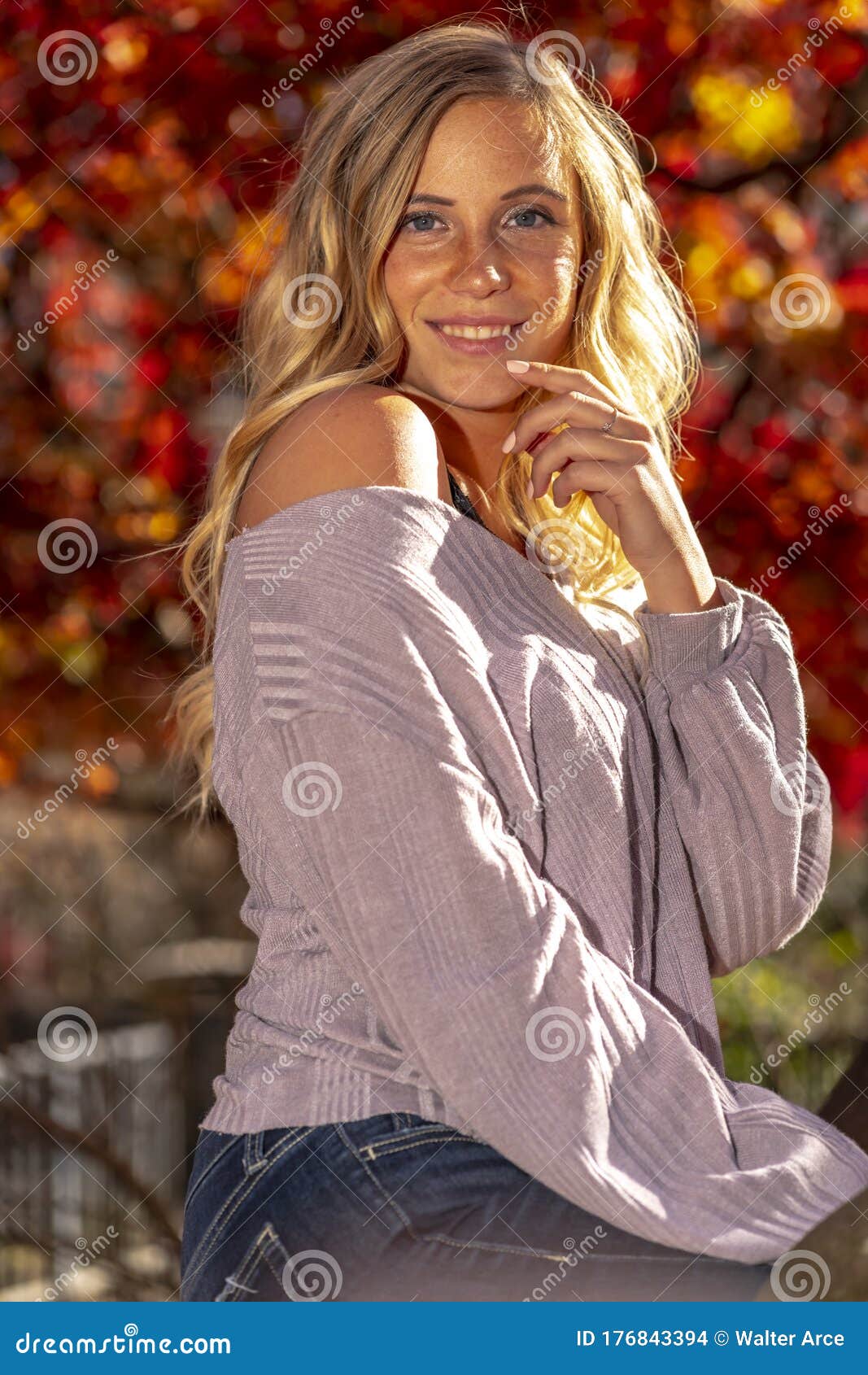 A Lovely Blonde Model Enjoys An Autumn Day Outdoors At The Park Stock 