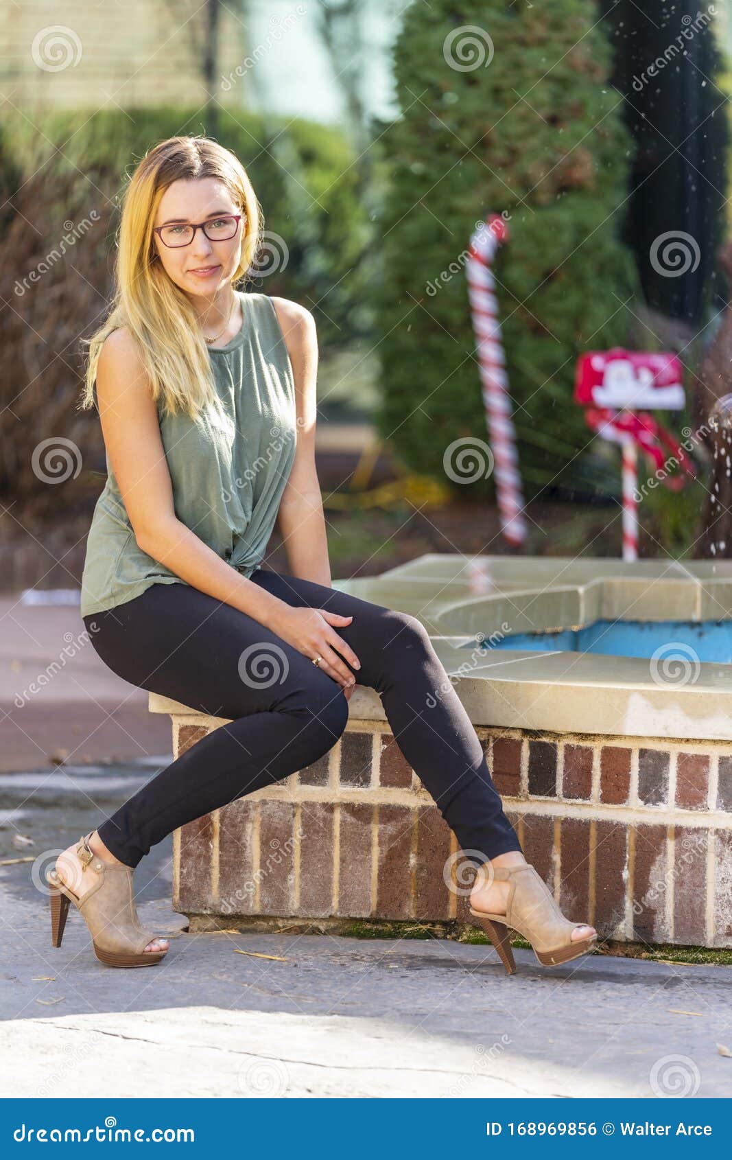 A Lovely Blonde Model Enjoys An Autumn Day Outdoors In A Small Town